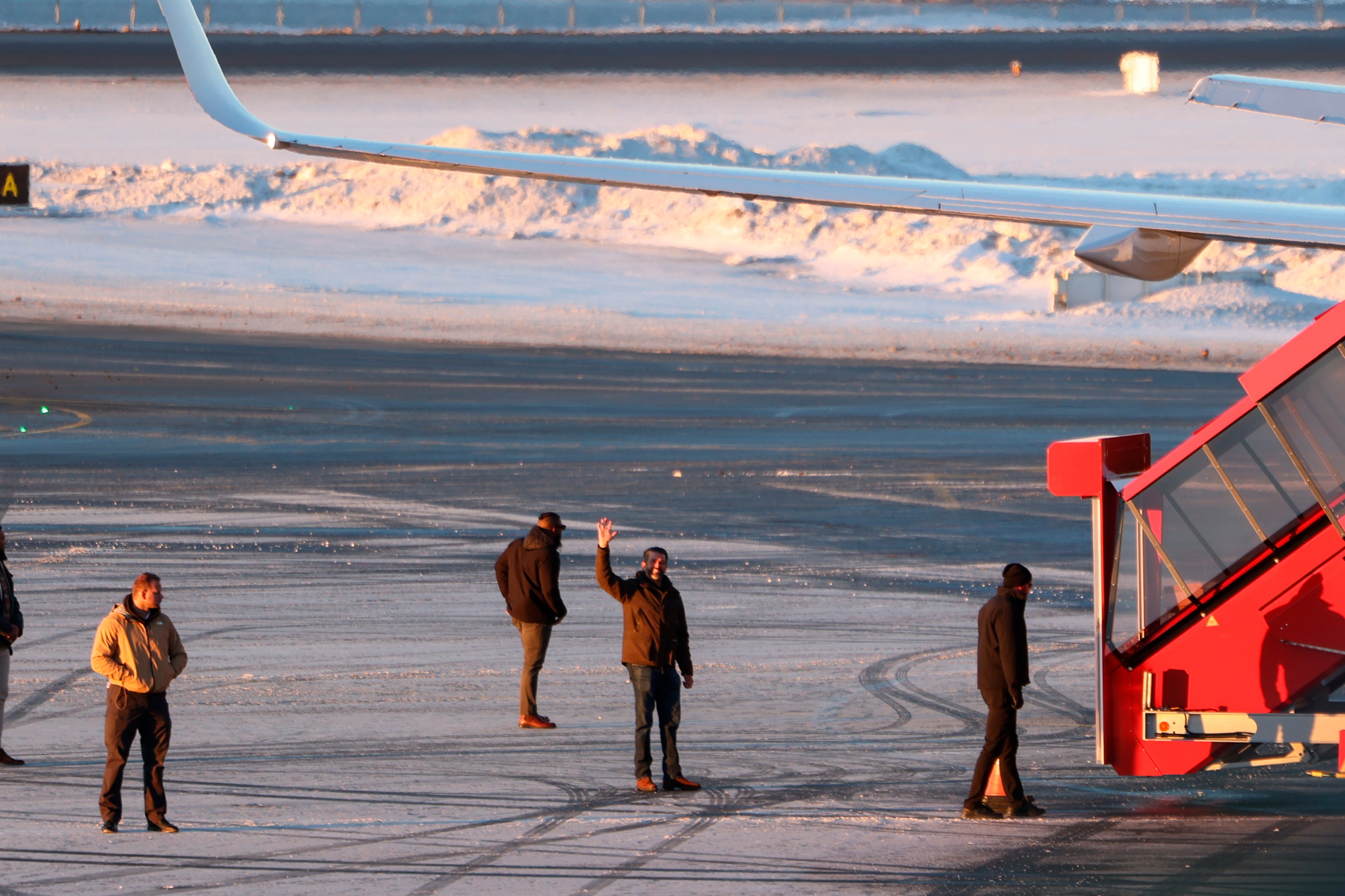 Donald Trump Jr. waves to a small crowd of Greenlanders who showed up to the Nuuk airport to greet him. He was promised that many in the town of 20,000 would show up