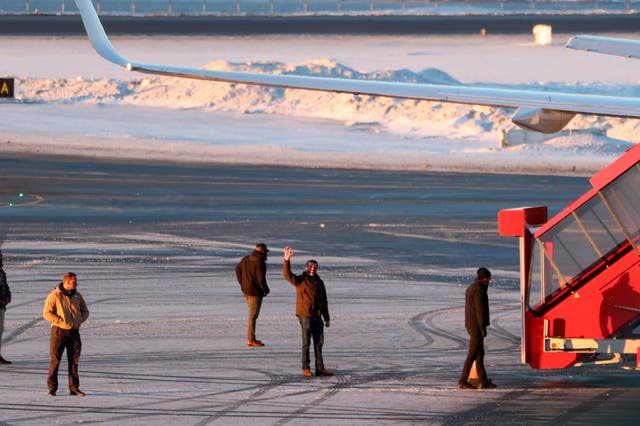 <p>Donald Trump Jr. waves to a small crowd of Greenlanders who showed up to the Nuuk airport to greet him</p>