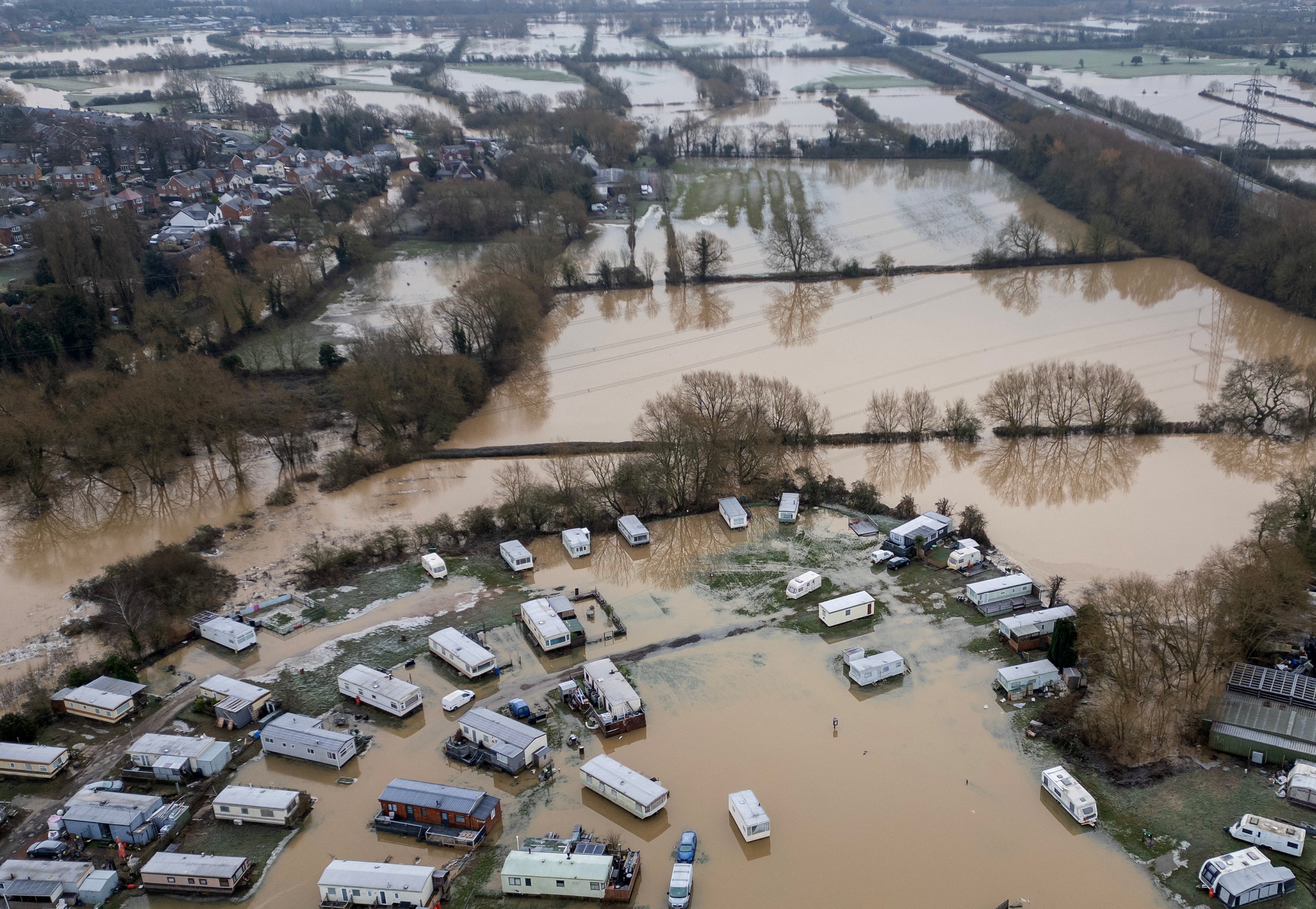 Caravans are surrounded by water as water levels begin to drop after heavy rain caused flooding in Barrow-Upon-Soar