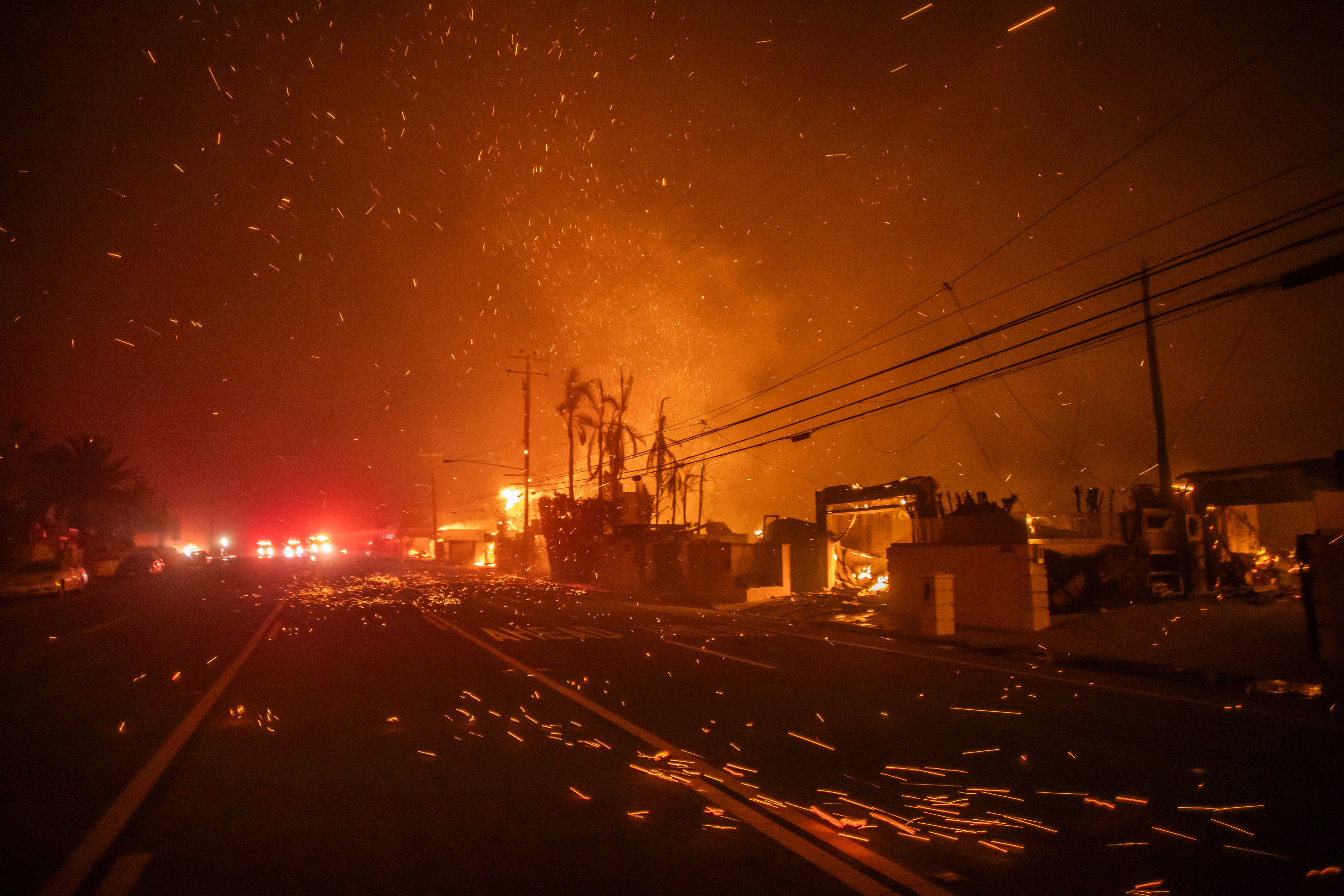 Strong winds blow embers as the Palisades Fire burns homes in Los Angeles, California, on Wednesday.