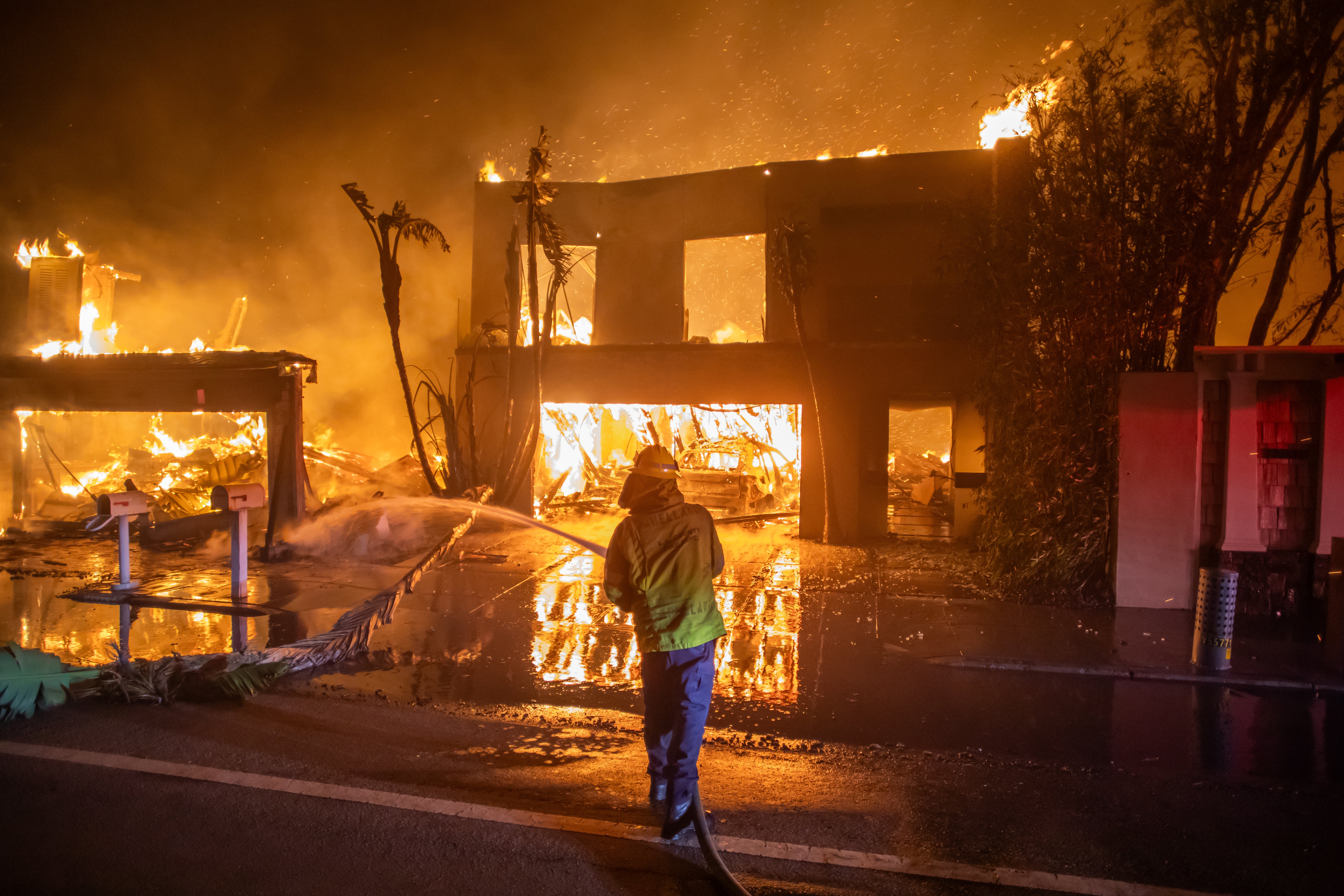 A firefighter battles the Palisades Fire on Wednesday in Los Angeles, California.