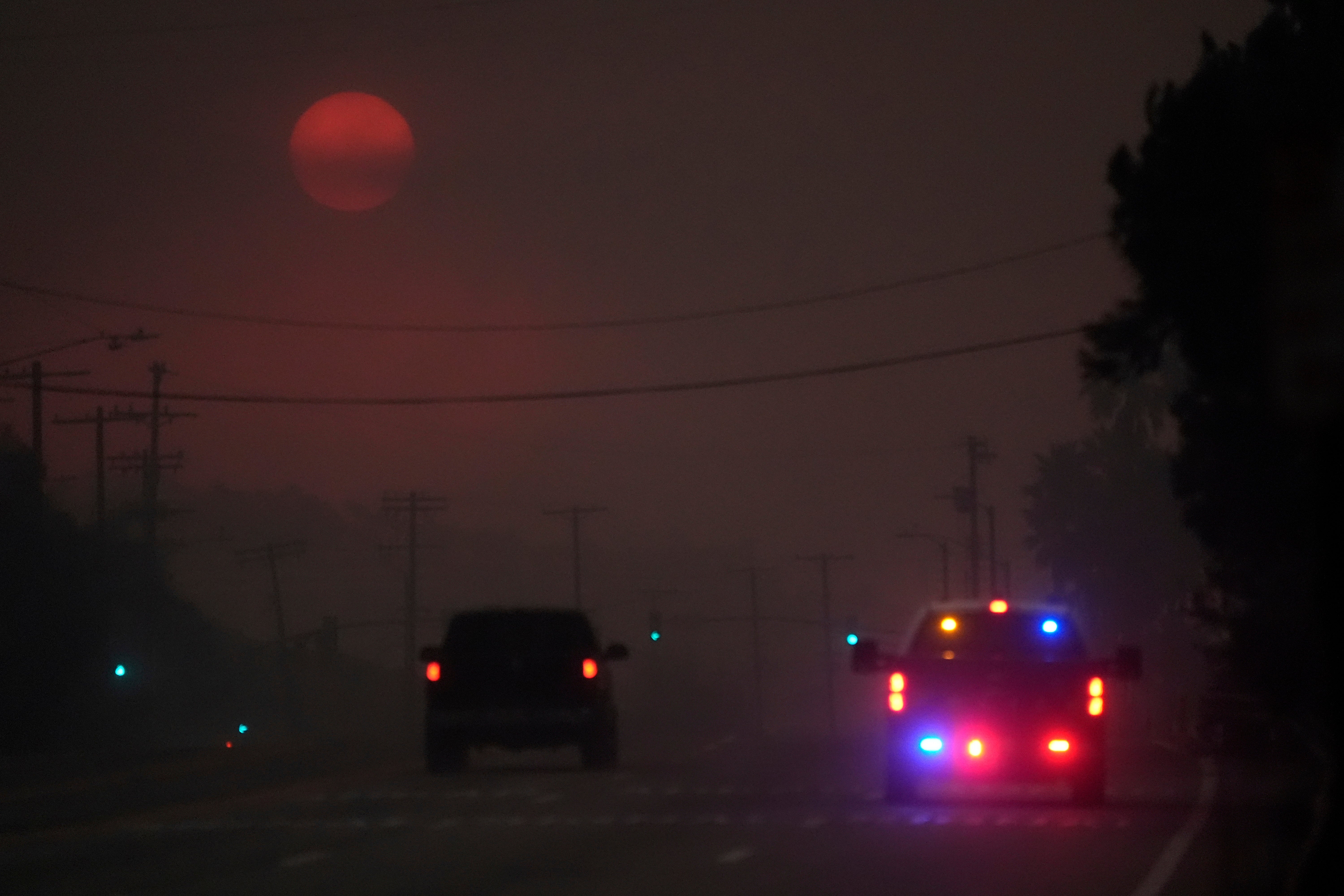 The Palisades Fire brings smoke-filled skies to the Pacific Palisades neighborhood of Los Angeles, California, on Wednesday. Whipping winds continued to fan the flames