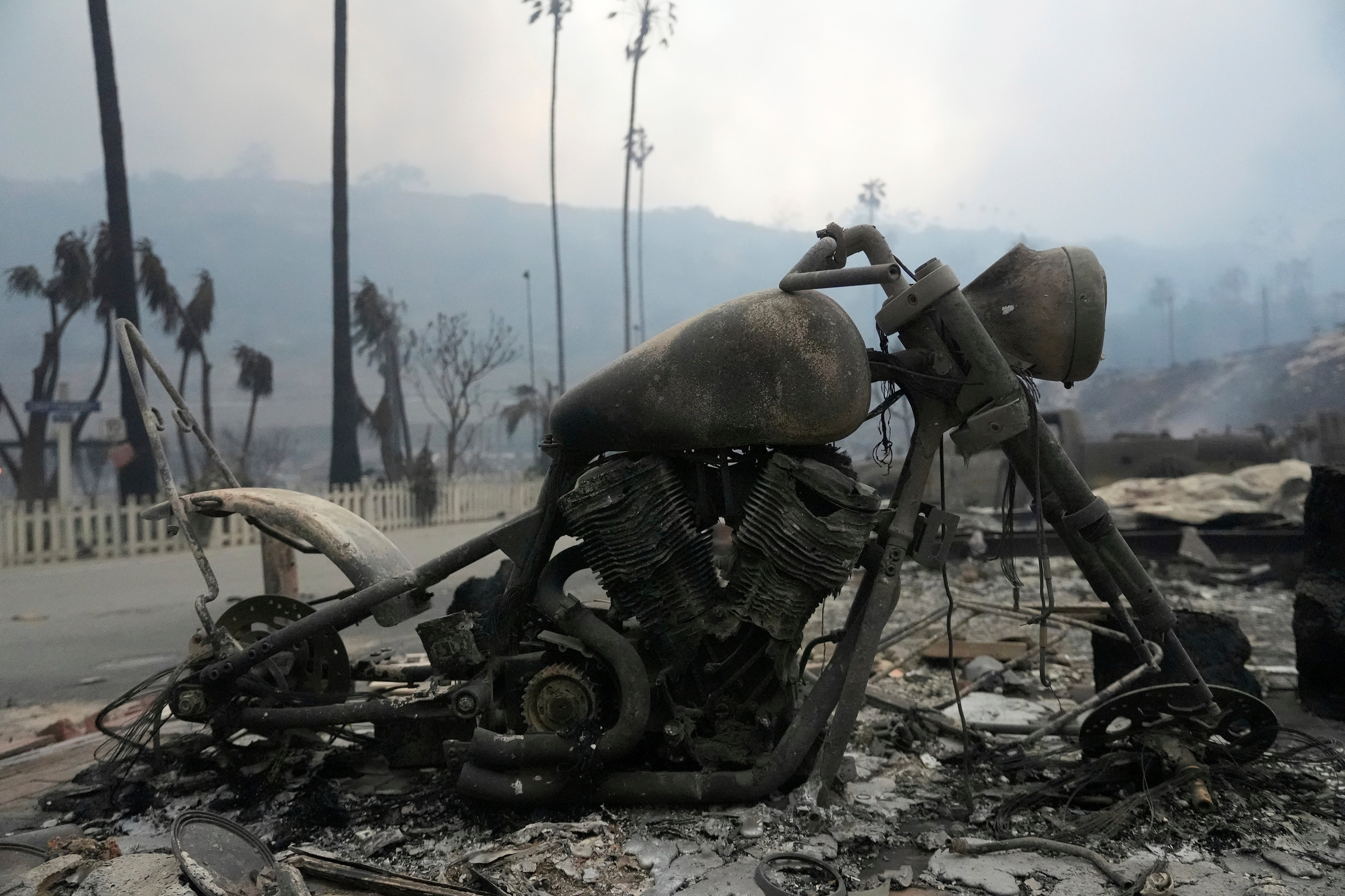 A burned vehicle is seen in the aftermath of the Palisades Fire on Wednesday in the Pacific Palisades neighborhood of Los Angeles, California. Evacuation orders are still in place