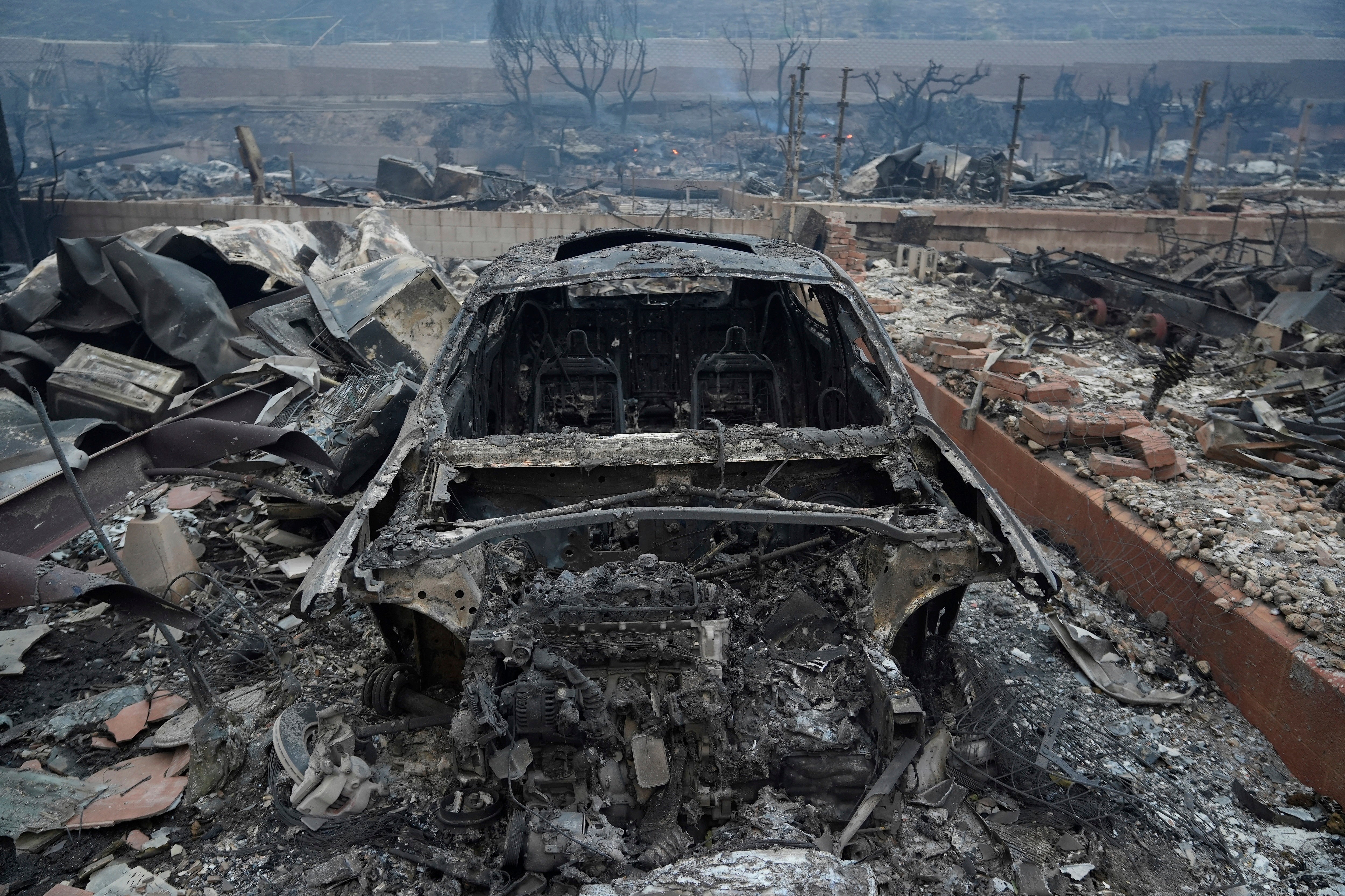 Destruction is seen in the aftermath of the Palisades Fire in Southern California on Wednesday. The wildfire was not yet contained