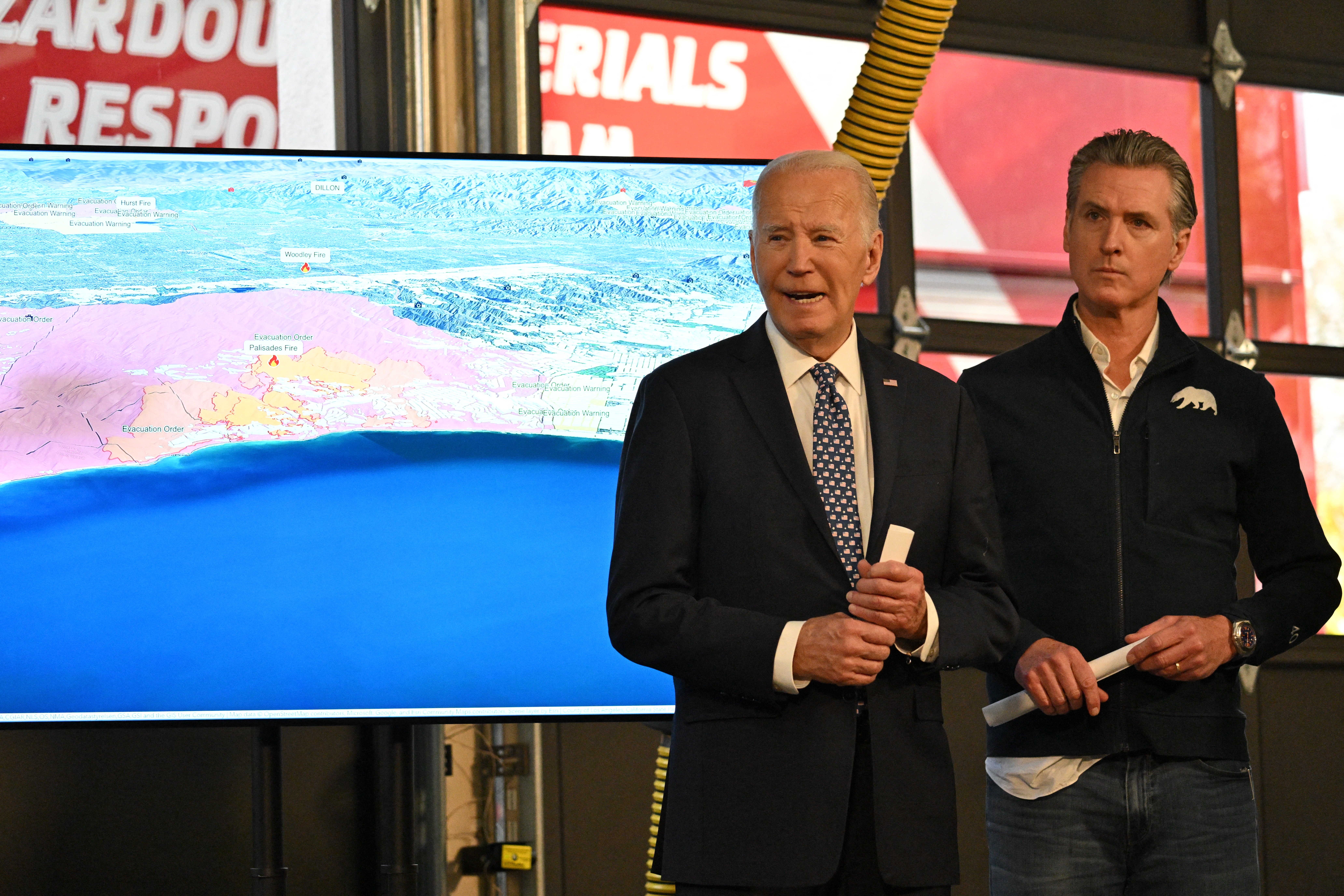 President Joe Biden, left, speaks at a press conference with California Governor Gavin Newsom and Los Angeles fire officials. The fires hampered the president’s travel plans