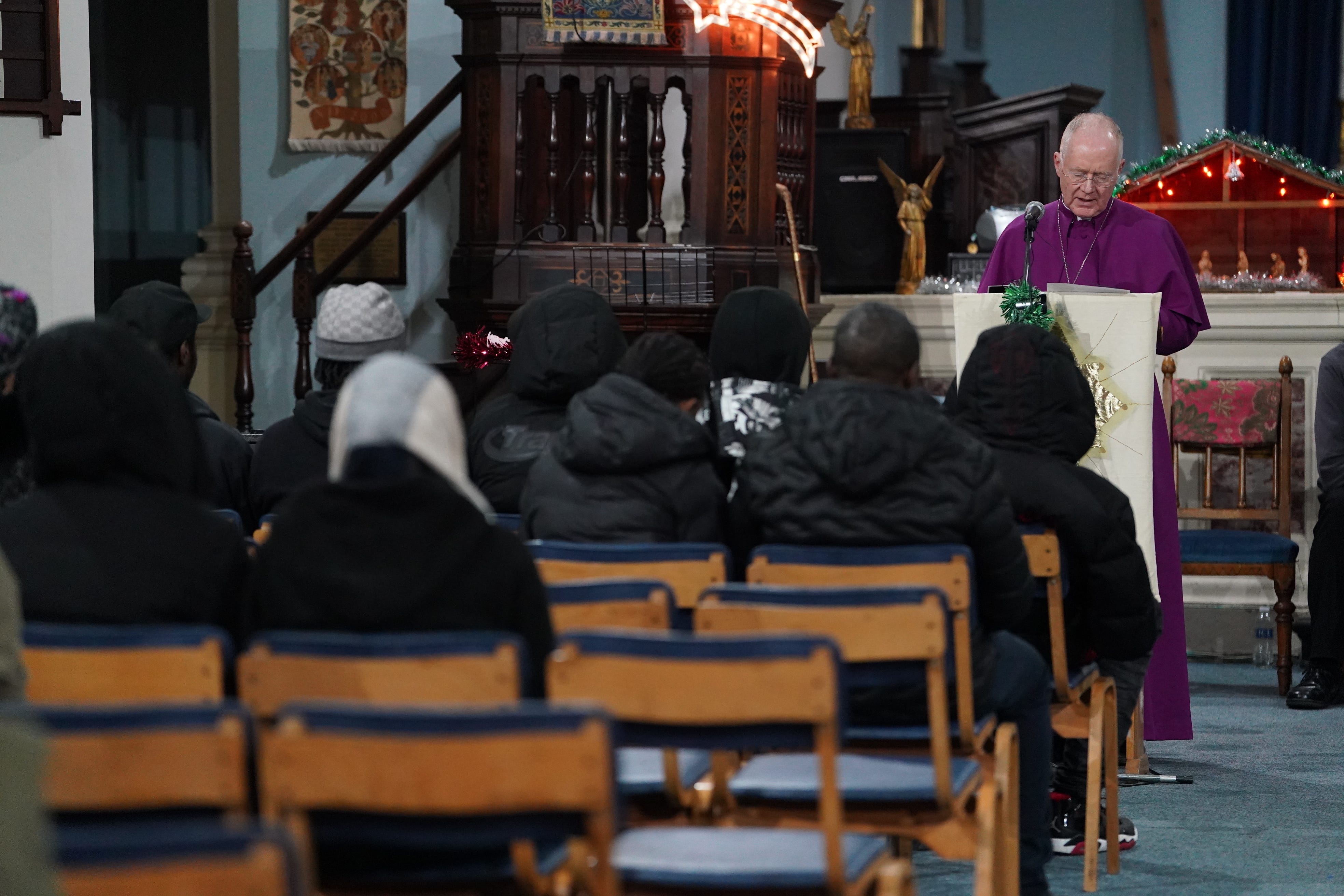 Around 40 mourners attended a vigil held at a church overlooking where Kelyan died (Lucy North/PA)