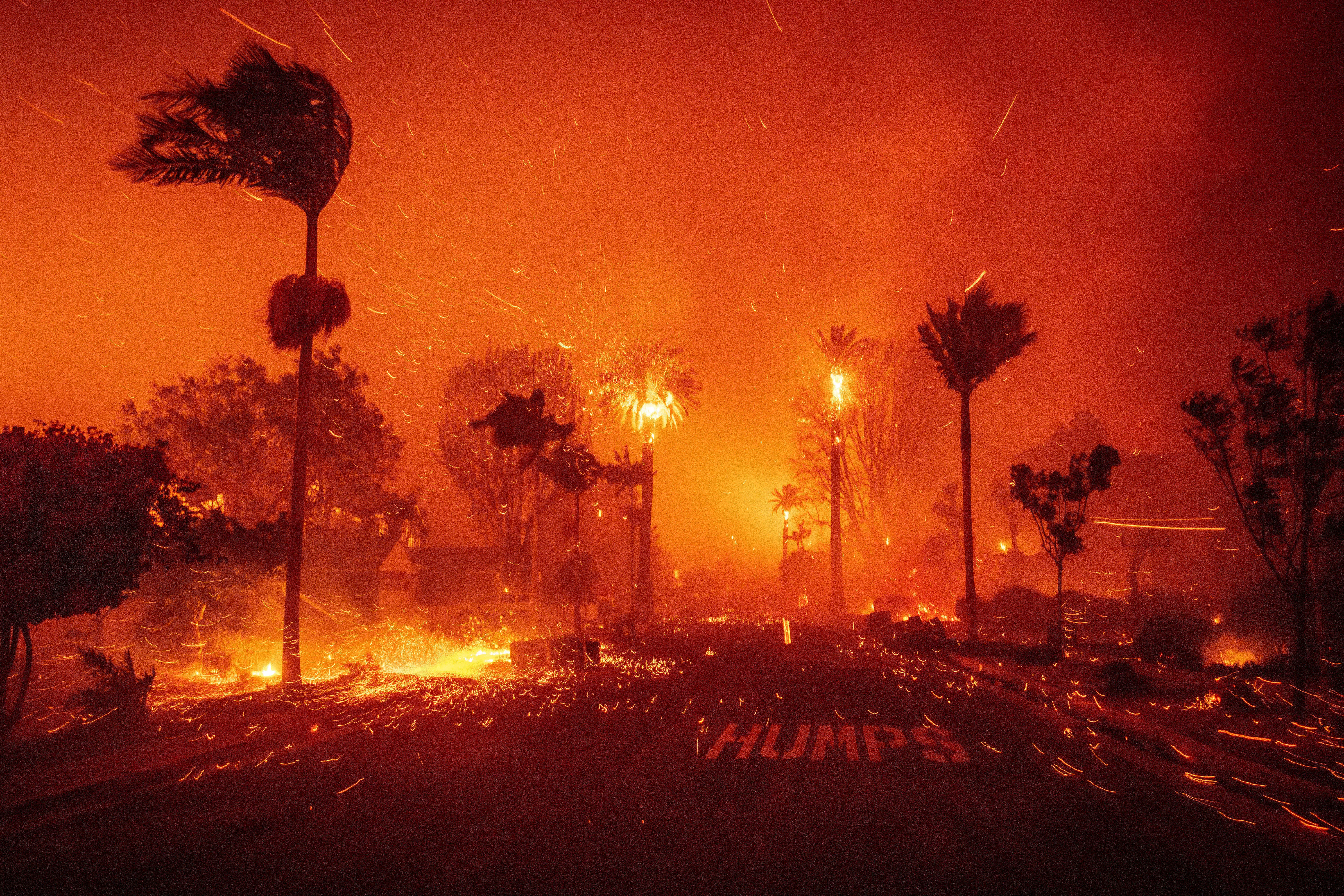 The Palisades Fire ravages a neighborhood amid high winds in the Pacific Palisades neighborhood of Los Angeles