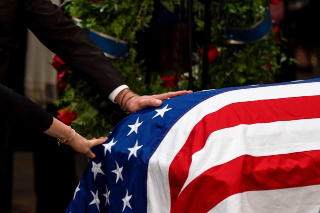 <p>The flag-draped casket of former US president Jimmy Carter</p>