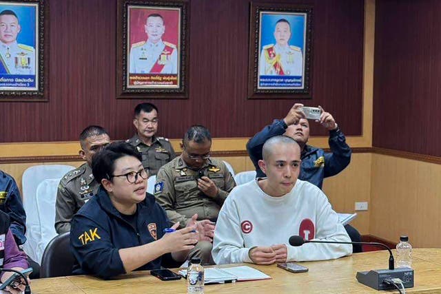 <p>Chinese actor Wang Xing, right, speaks with Thai police in Mae Sot district</p>