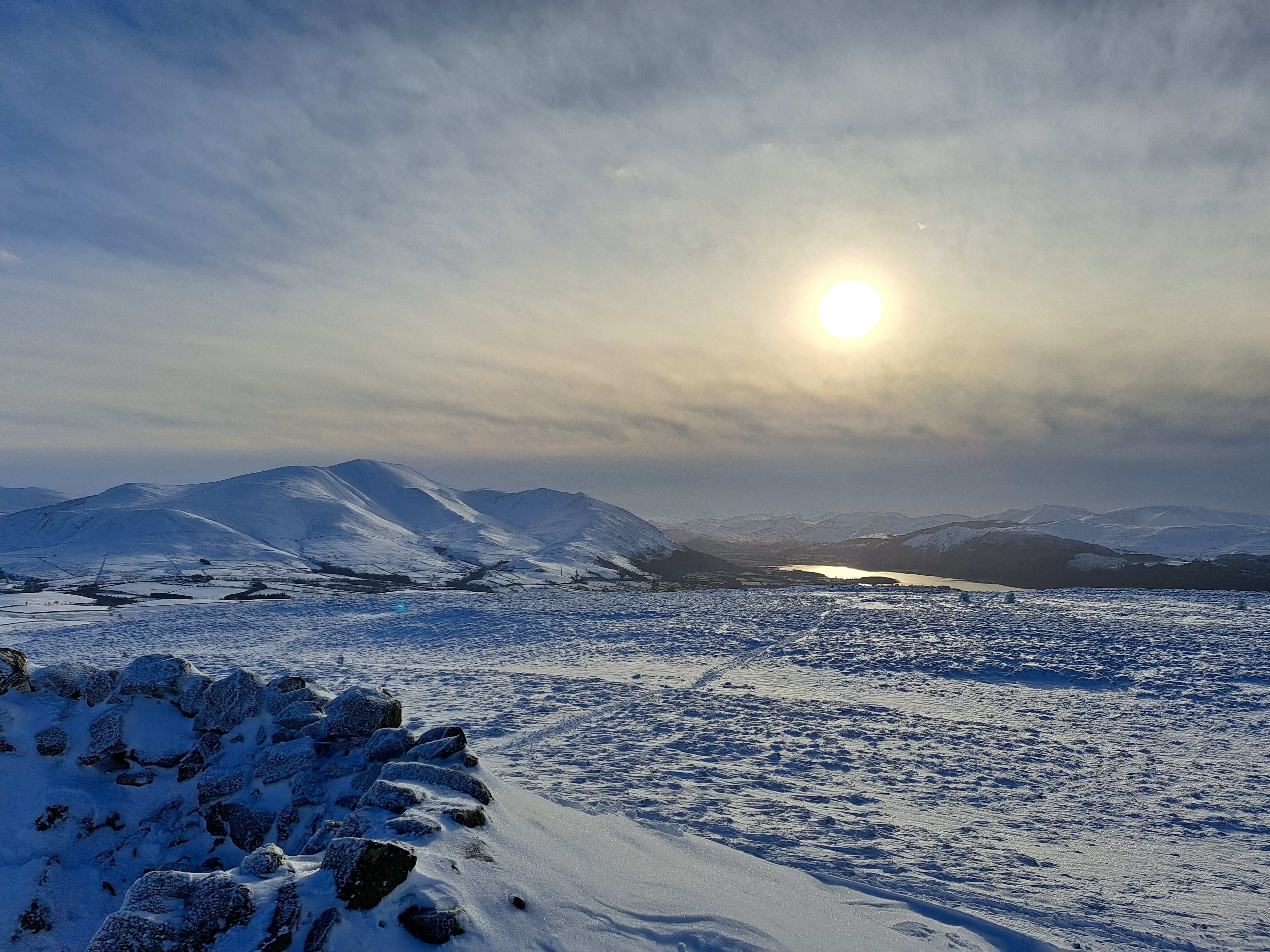 The sun rises over Binsey Fell near Bothel, Cumbria