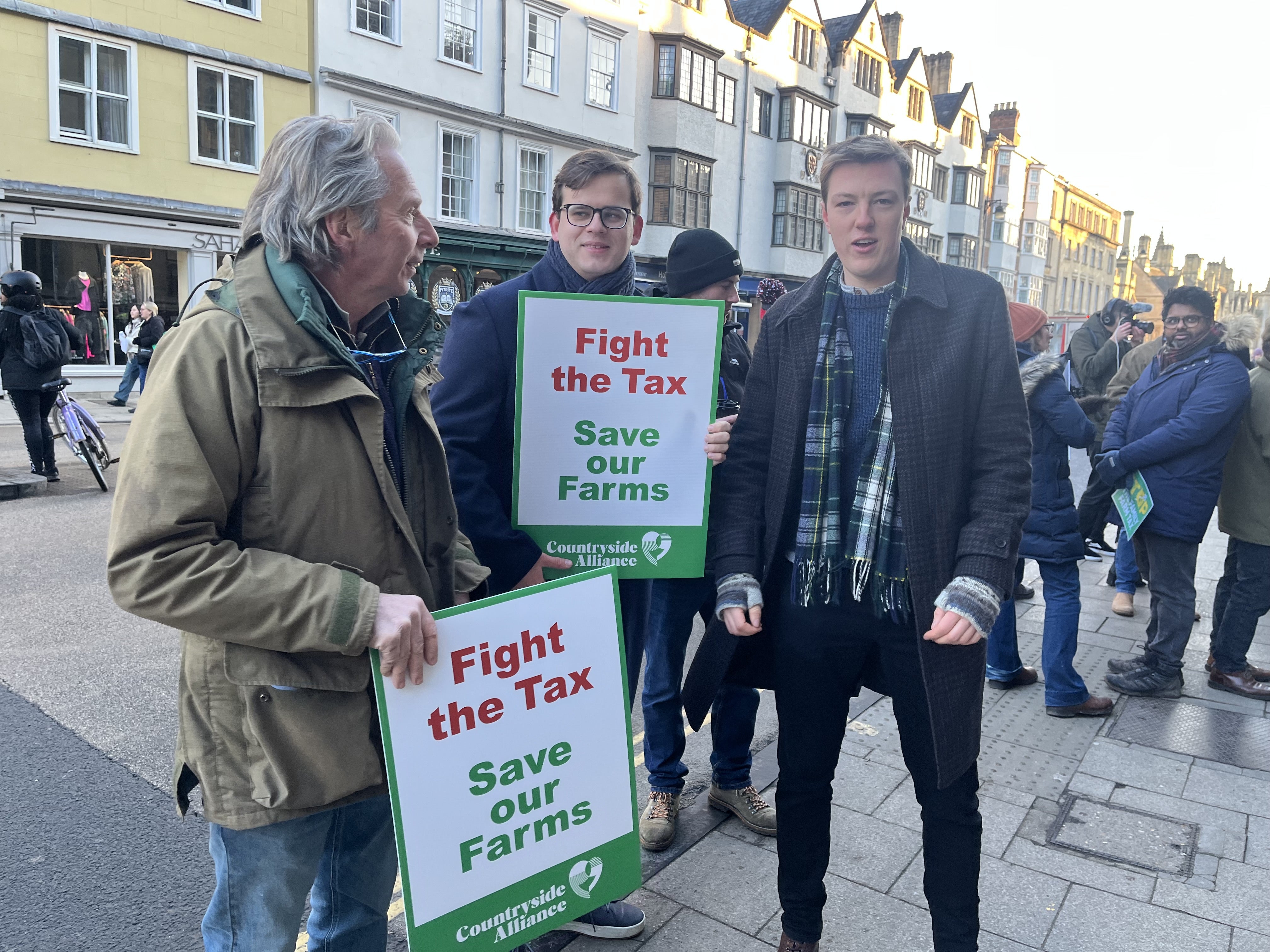 Olli Fletcher (right), a 23-year-old from a dairy farming family based in Leicester, with other farmers at the protests (Rebecca Speare-Cole/PA)