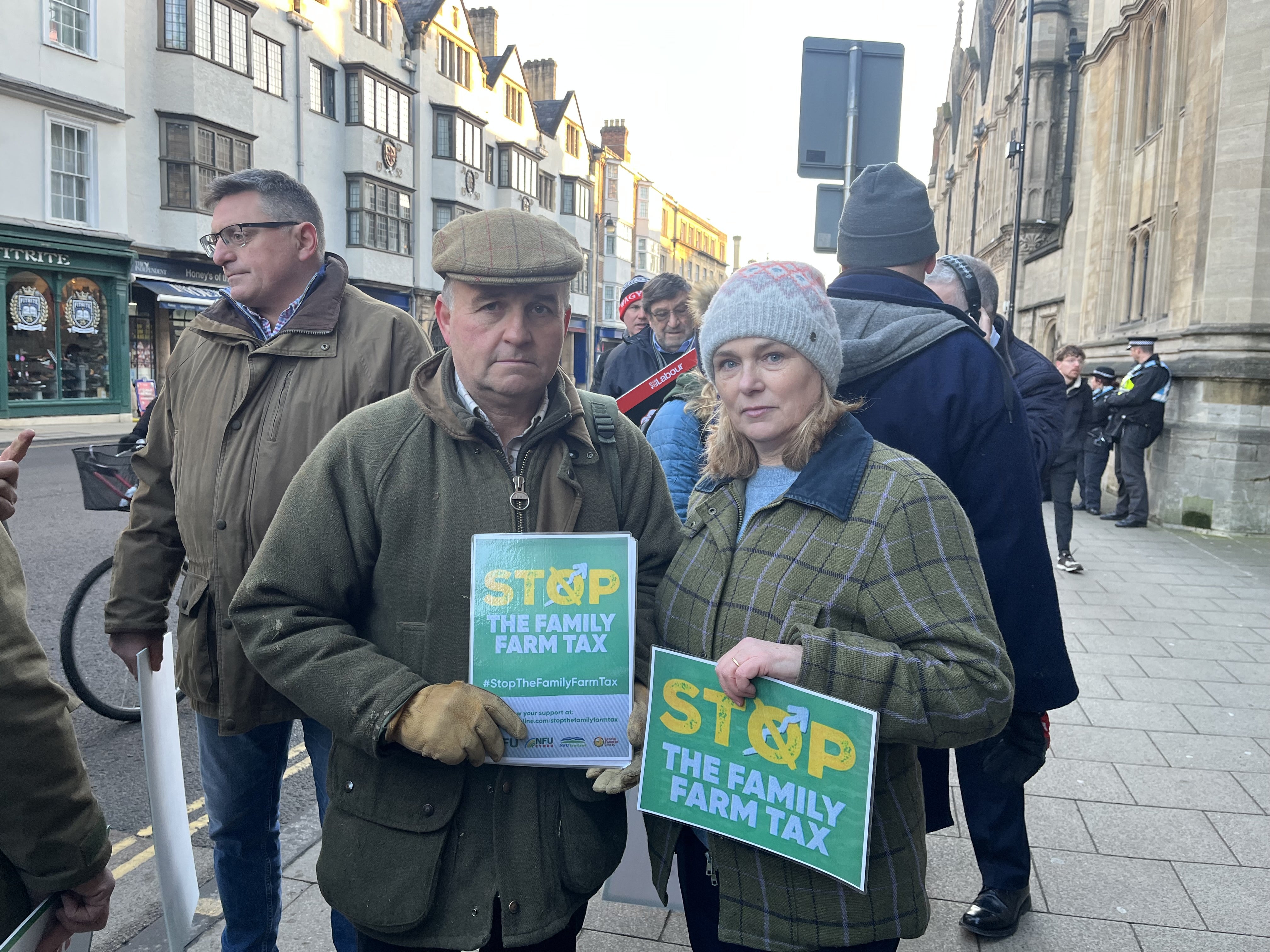 Heidi and Jonathan Smith, farmers from Oxfordshire, take part in a protest over the changes to inheritance tax rules outside the Oxford Farming Conference (Rebecca Speare-Cole/PA)