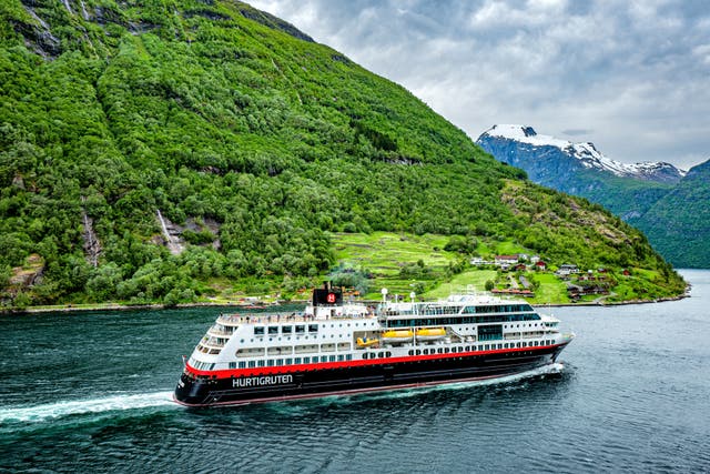 <p>Passengers can hug the Norwegian coastline with Hurtigruten</p>
