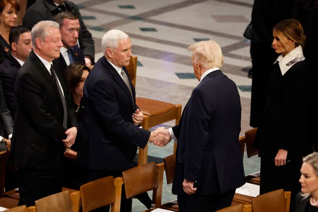 <p>U.S. President-elect Donald Trump greets former U.S. Vice President Mike Pence as he arrives with Melania Trump as former U.S. Vice President Al Gore looks on during the state funeral for former U.S. President Jimmy Carter at Washington National Cathedral on January 09, 2025 in Washington, DC</p>