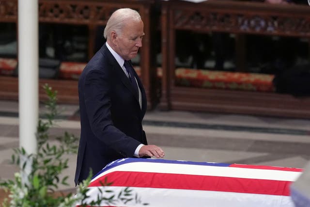 <p>President Joe Biden touches the casket of former President Jimmy Carter during a state funeral service at Washington National Cathedral in Washington, Thursday, Jan. 9, 2025</p>