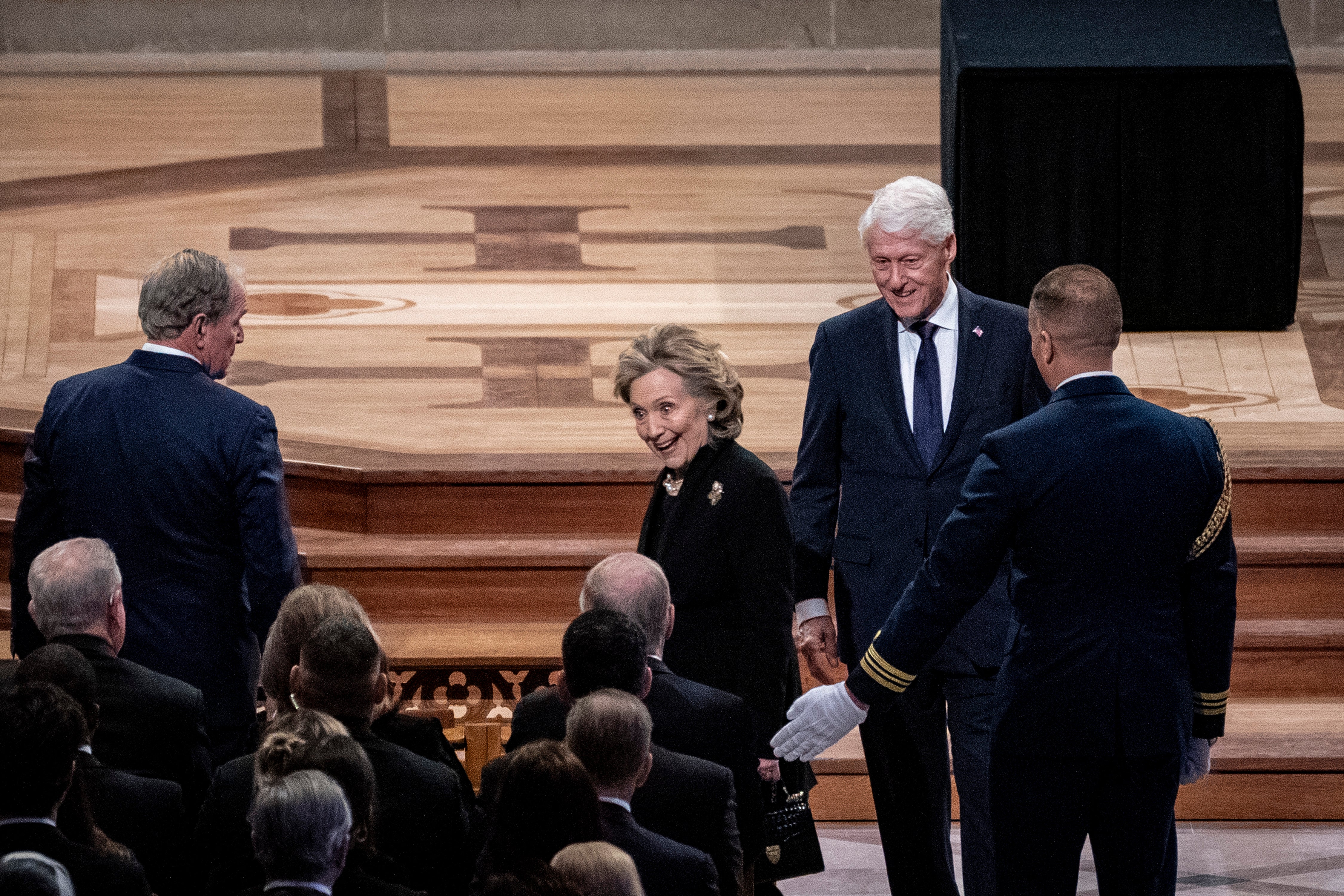 Former President Bill Clinton and first lady Hillary Clinton mostly spoke to each other during the ceremony.