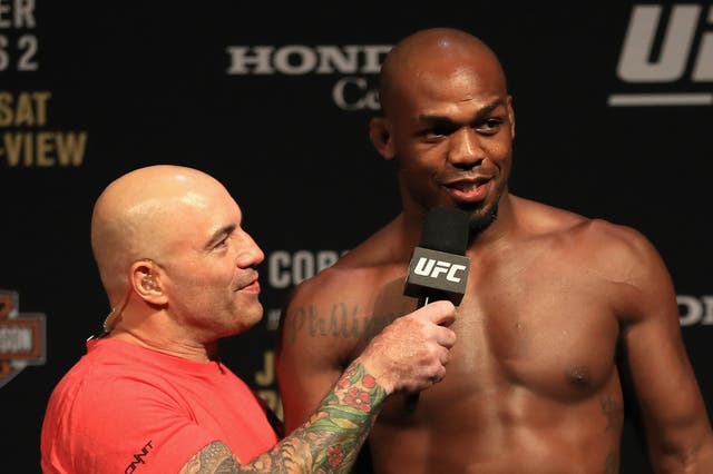 <p>UFC commentator Joe Rogan, now chiefly a podcaster, with Jon Jones (right)</p>