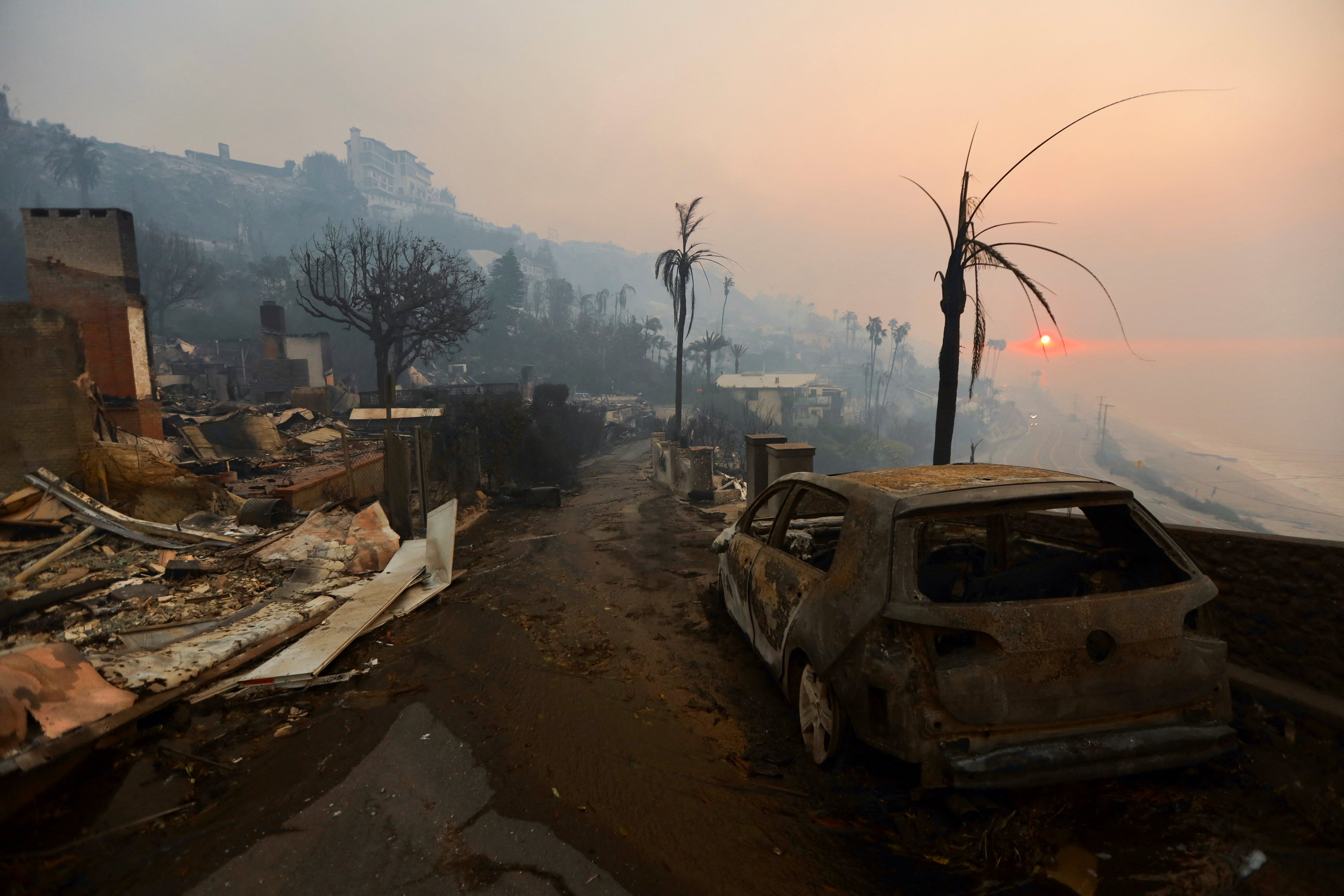 The sun rises over the Pacific Palisades neighborhood of west Los Angeles, California, on Thursday following devastating wildfires. The fire is still not contained