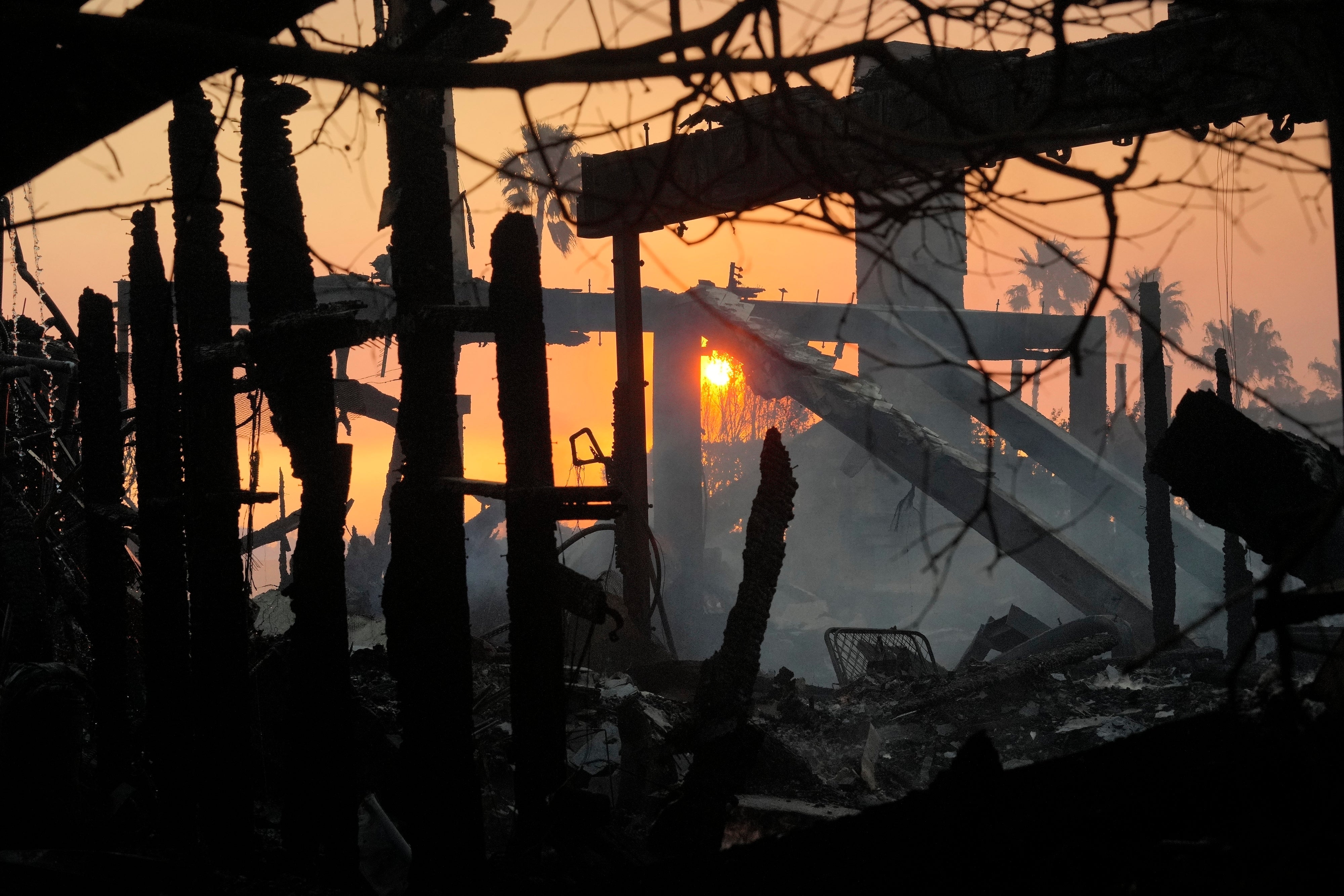 The sun rises after the Palisades Fire in the Pacific Palisades neighborhood of Los Angeles, California, on Thursday. Windy conditions resulted in fast-moving blazes in the region