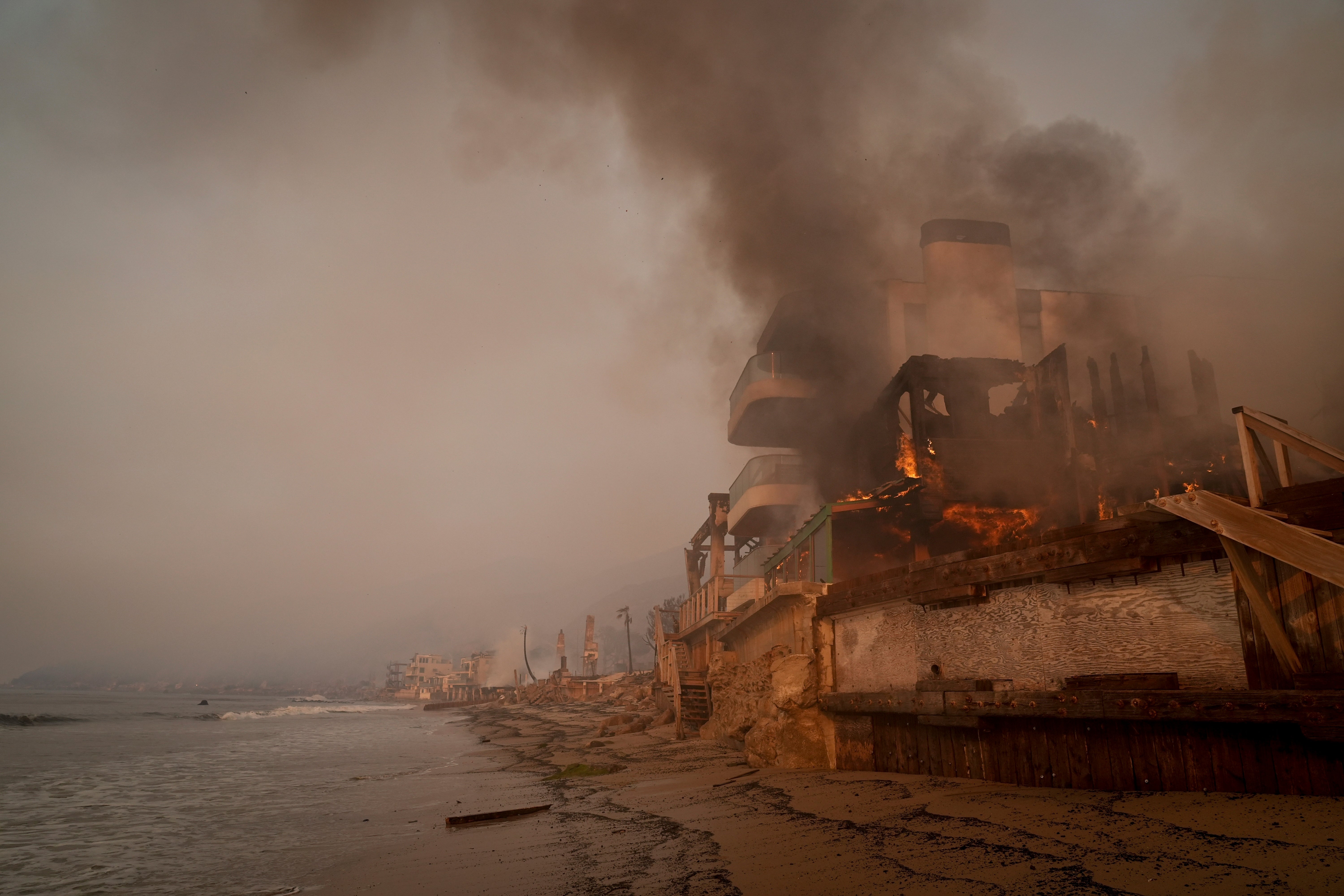 A beachfront property is burned by the Palisades Fire on Thursday in Malibu, California. Officials have warned leftover debris could be hazardous