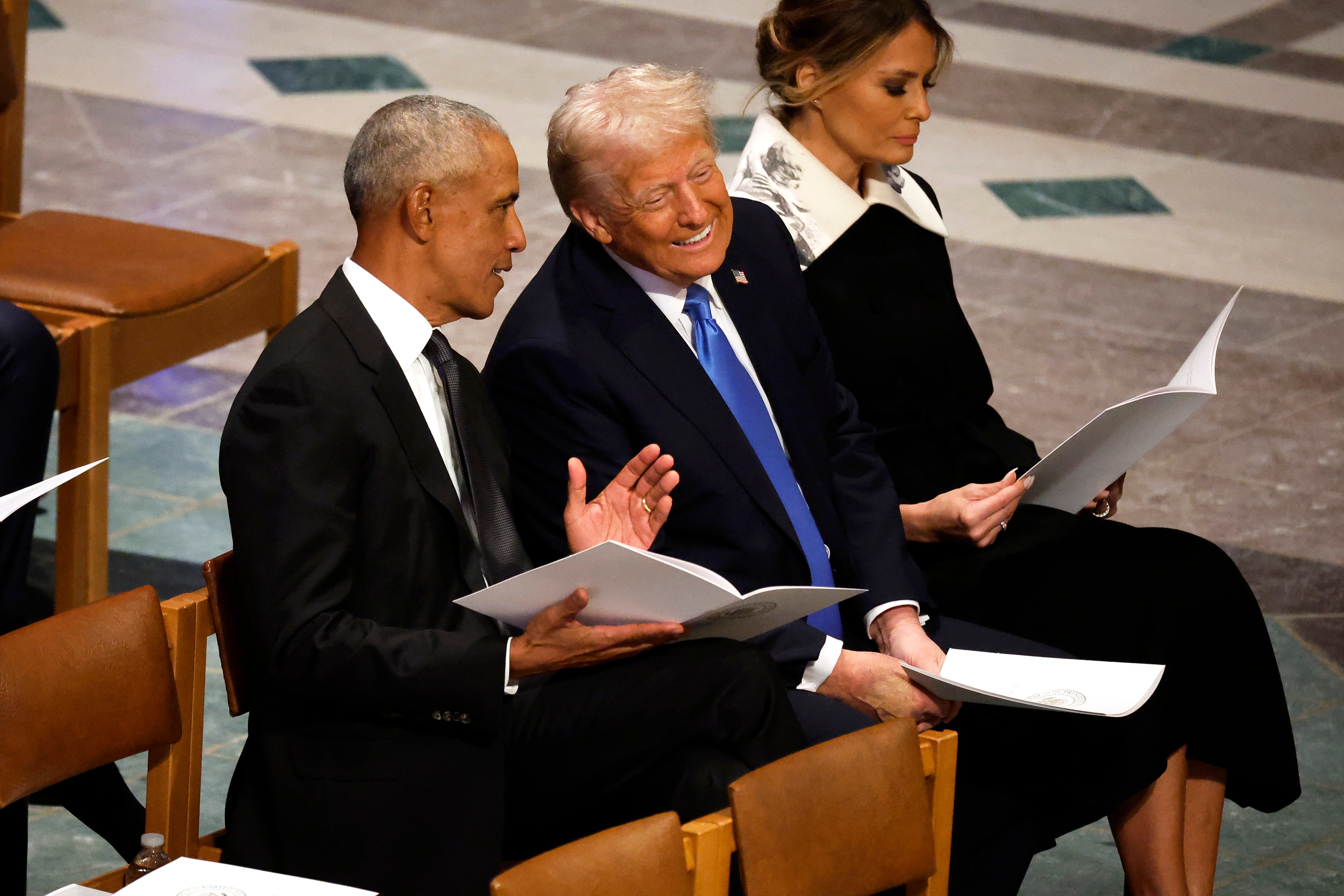 Donald Trump and Barack Obama seemed to enjoy each other’s company at Jimmy Carter’s funeral.