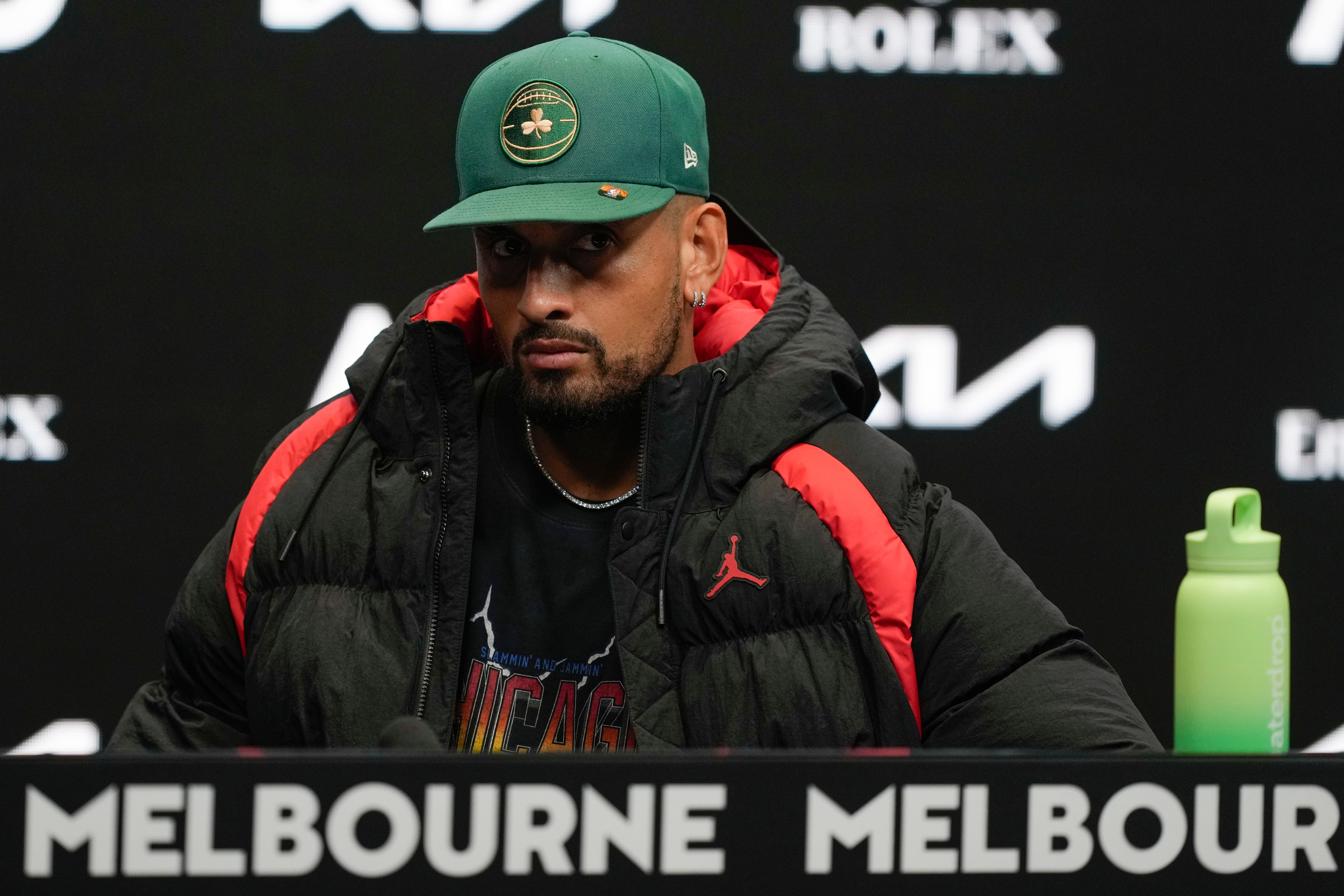 Nick Kyrgios answers questions at a press conference at Melbourne Park