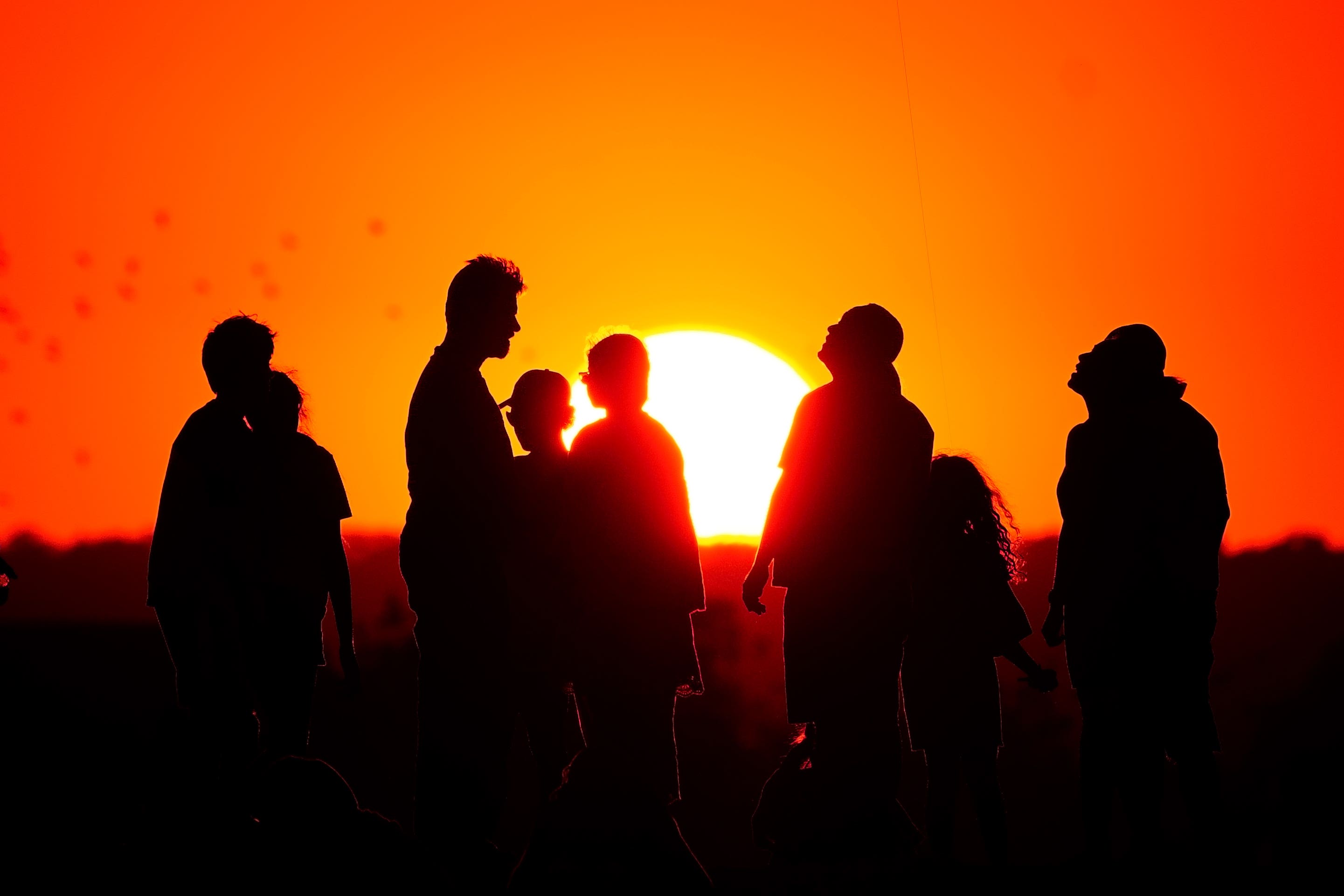 People watch the sunset during a heatwave (Victoria Jones/PA)