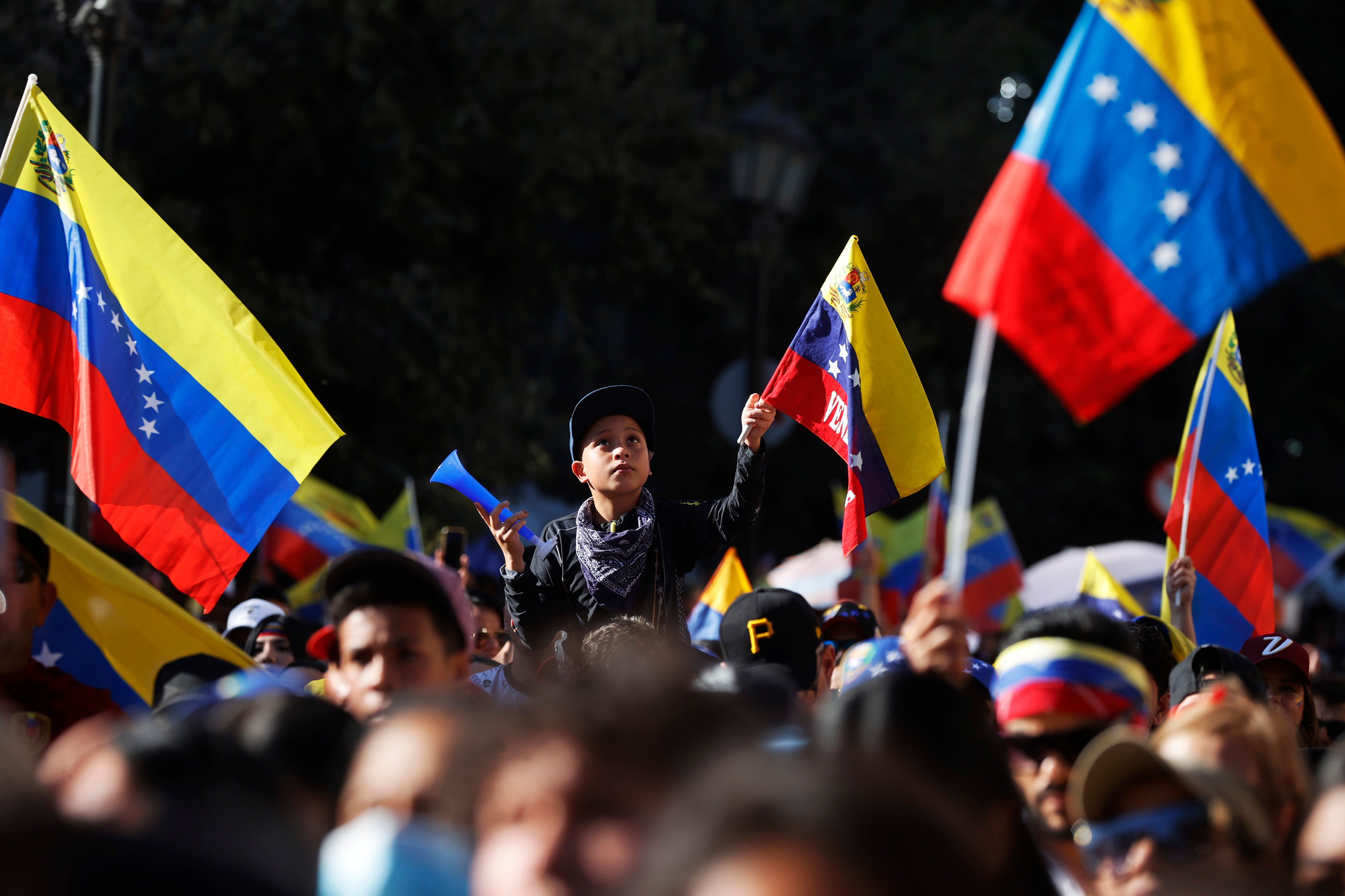 Venezuelan citizens participate during a demonstration in support of anti-Chavista leader Maria Corina Machado