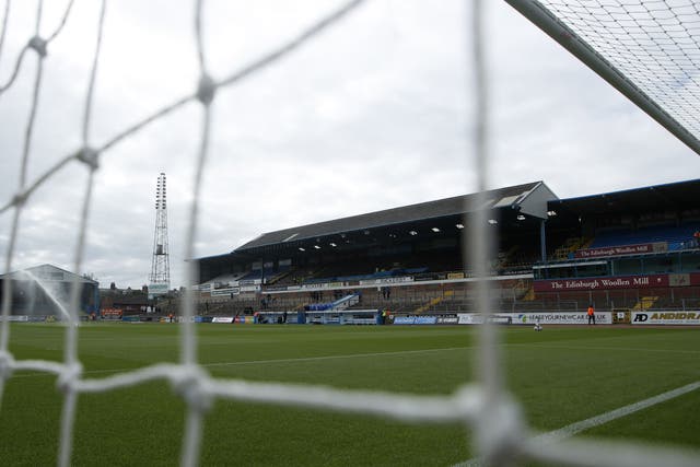 The Brunton Park pitch had been covered, but was still frozen (Will Matthews/PA)