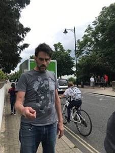 One man is pictured with dark hair, including facial hair