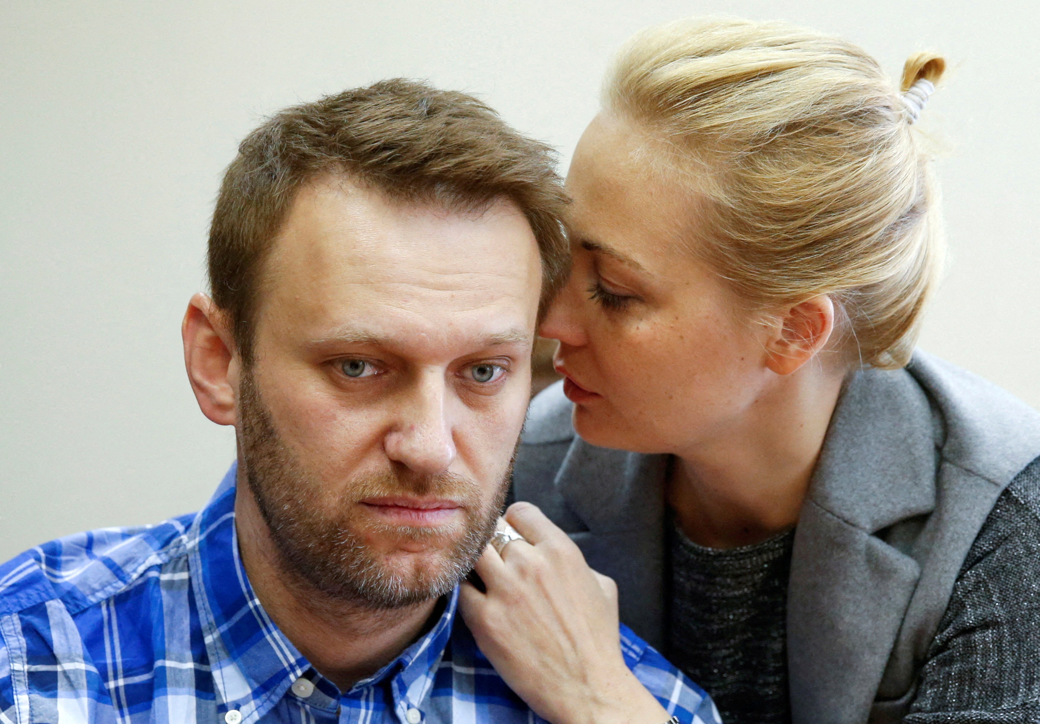 Russian opposition leader Alexei Navalny and his wife Yulia attend a hearing at the Lublinsky district court in Moscow