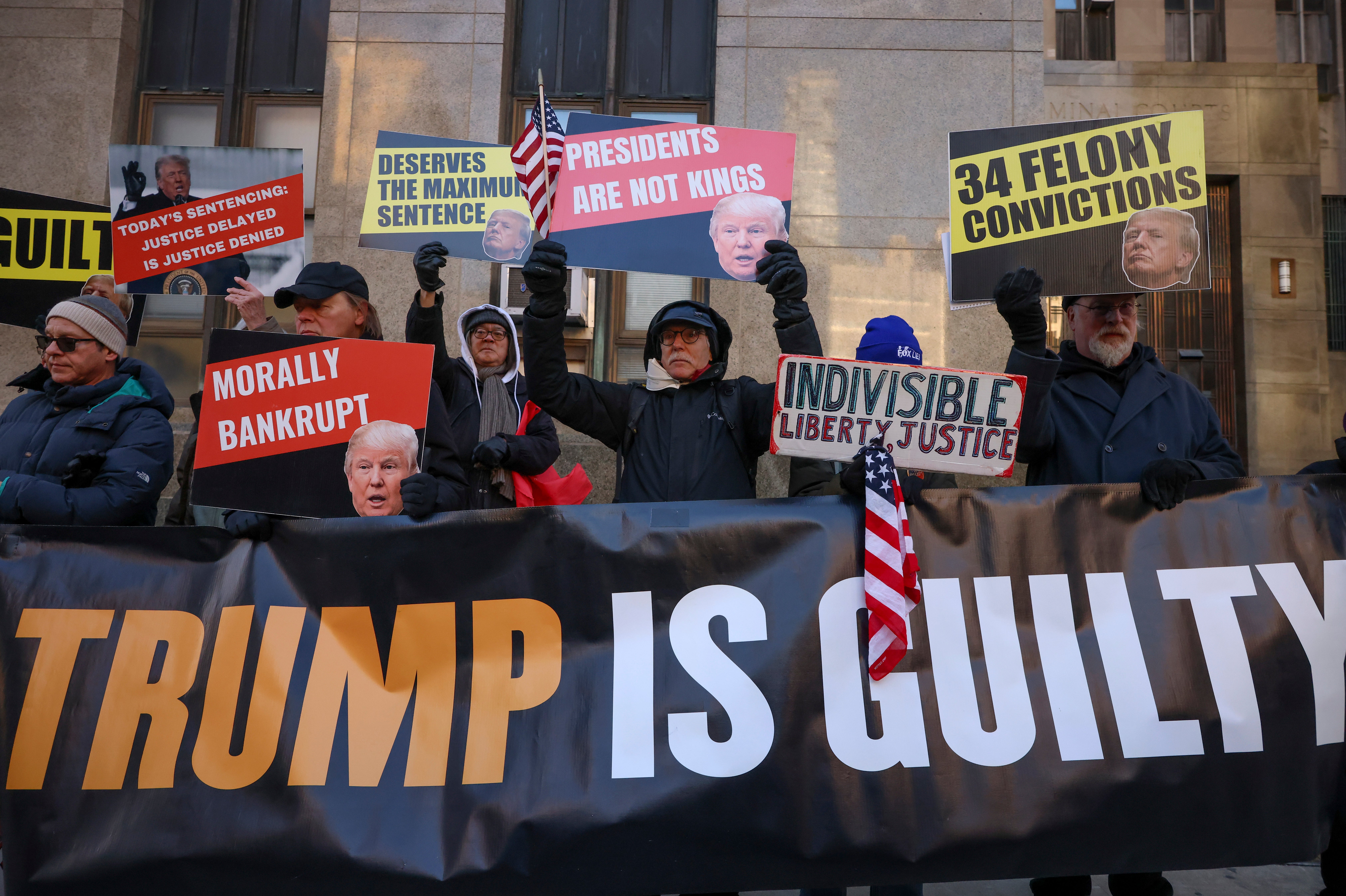 Demonstrators protest outside Manhattan criminal court before the start of the sentencing in Trump’s hush money case on January 10