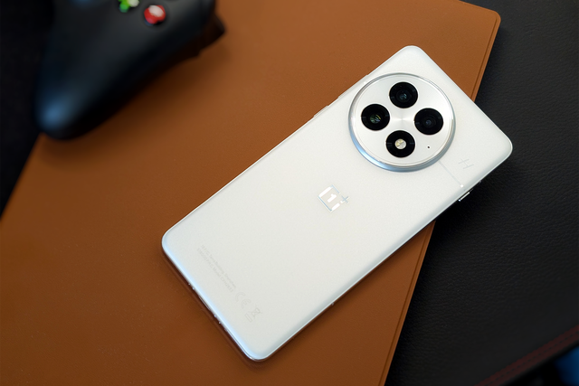 <p>The OnePlus 13 is available in three colourways: white (pictured), black, and a blue version featuring a “microfibre vegan leather” finish</p>