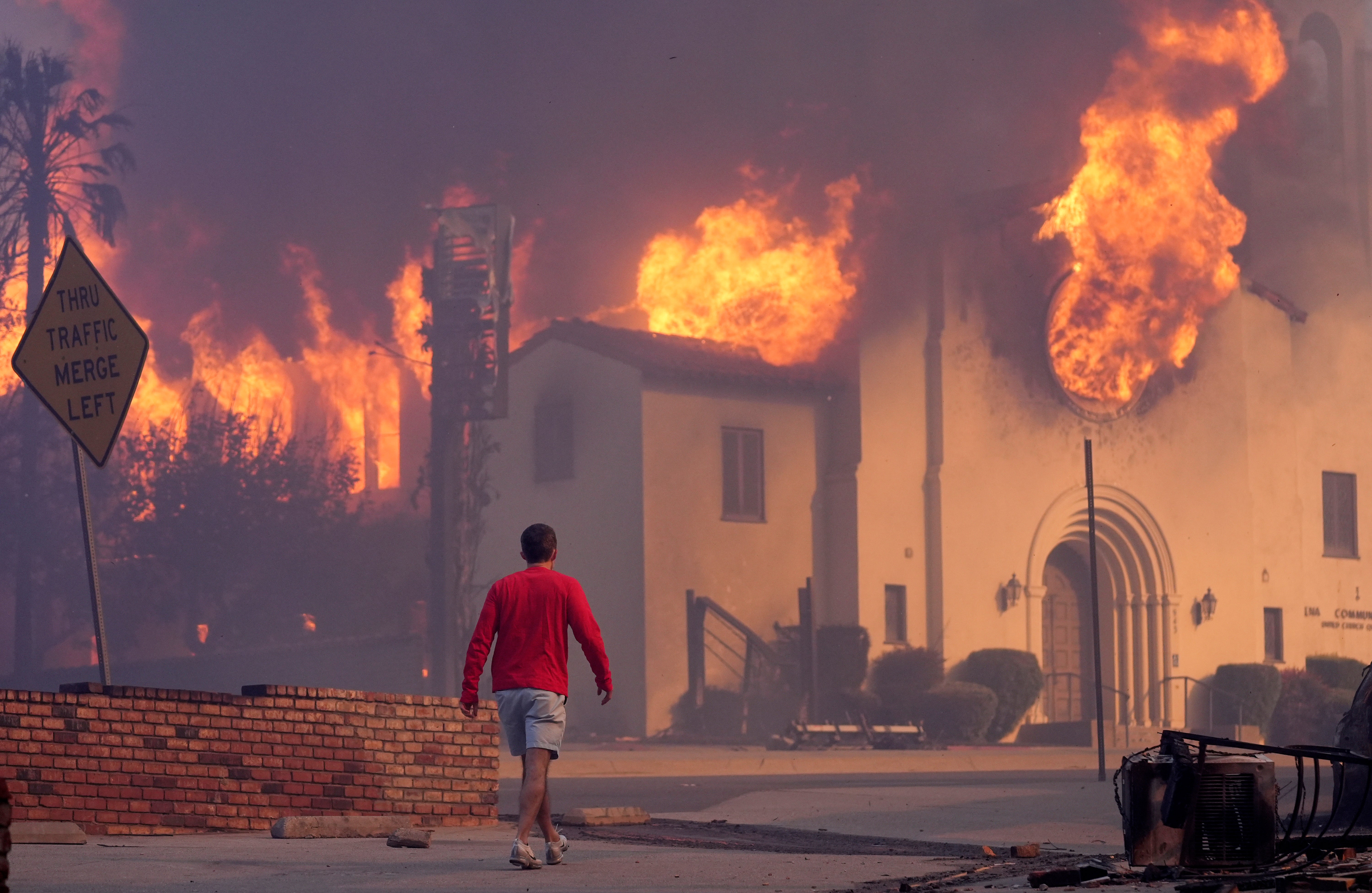 A building burns in Altadena, California, as wildfires scorch much of the Los Angeles area. The fires could soon spread to other aras if not contained