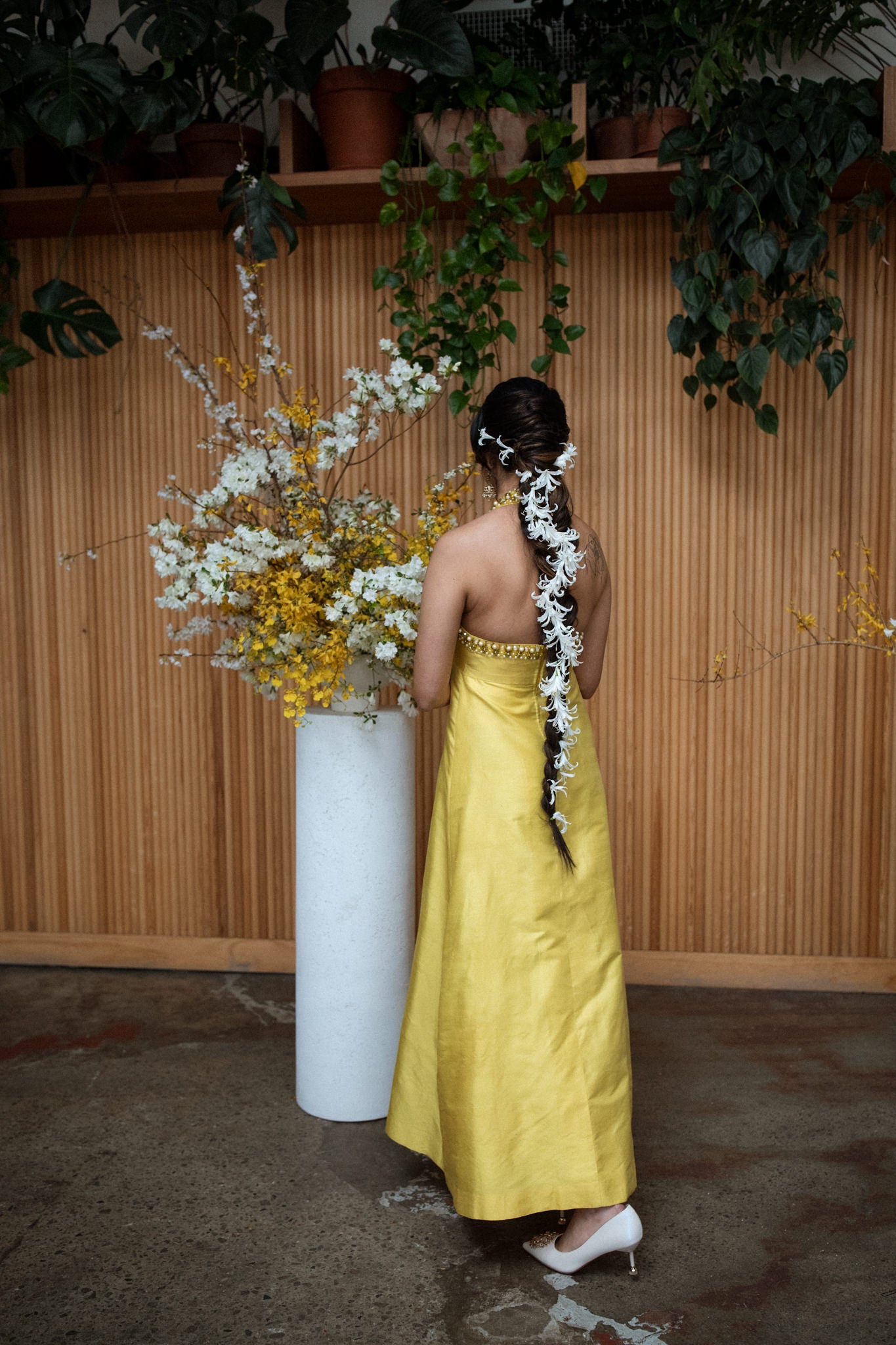 Bride wearing a yellow sating dress to her wedding, photographed by Sylvie Rosokoff