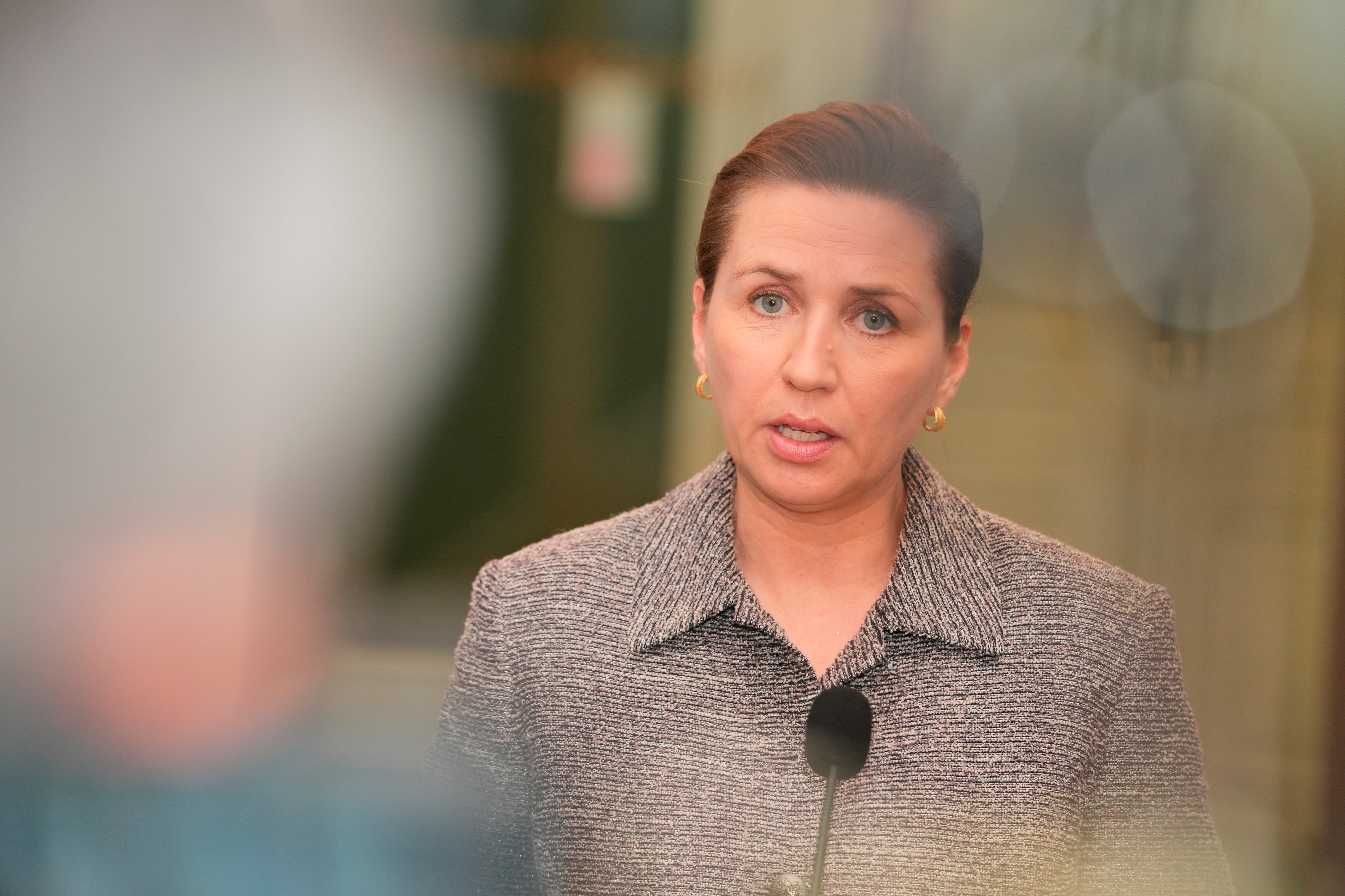 Denmark’s Prime Minister Mette Frederiksen speaks to the media after a meeting with party leaders