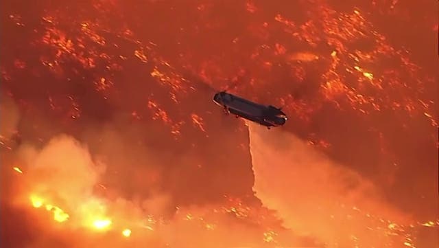 <p>Watch: Helicopters battle flames as Palisades fire burns on Santa Monica mountains.</p>