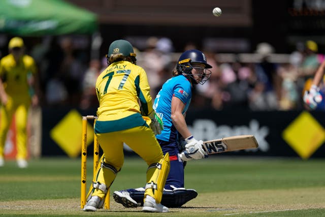 <p>England captain Heather Knight plays a reverse sweep shot</p>