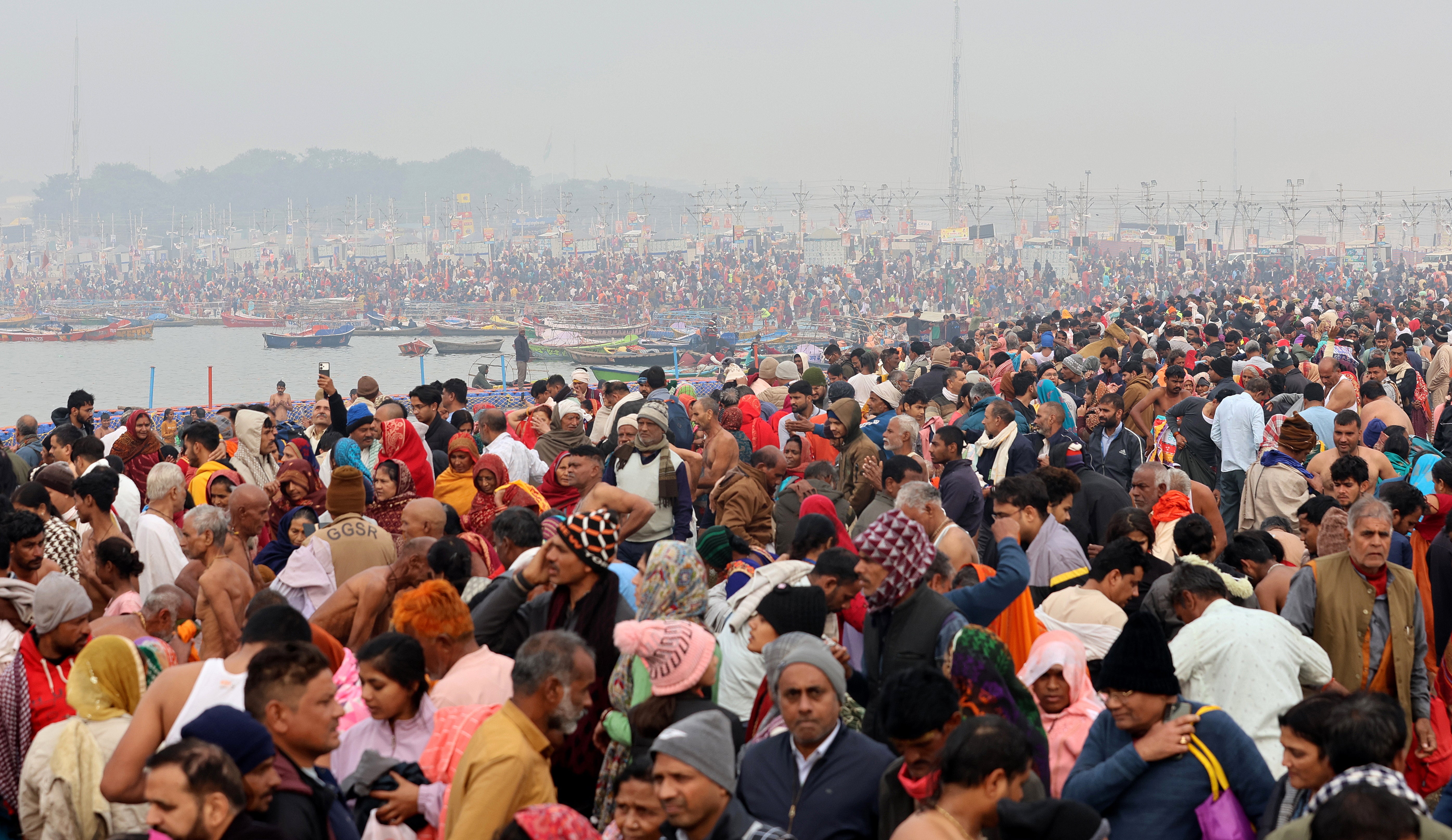 Hindu devotees gather to take a ‘holy bath’ at Sangam, the confluence of three of the holiest rivers in Hindu mythology – Ganga, Yamuna, and the mythical Saraswati – in Prayagraj, Uttar Pradesh, India