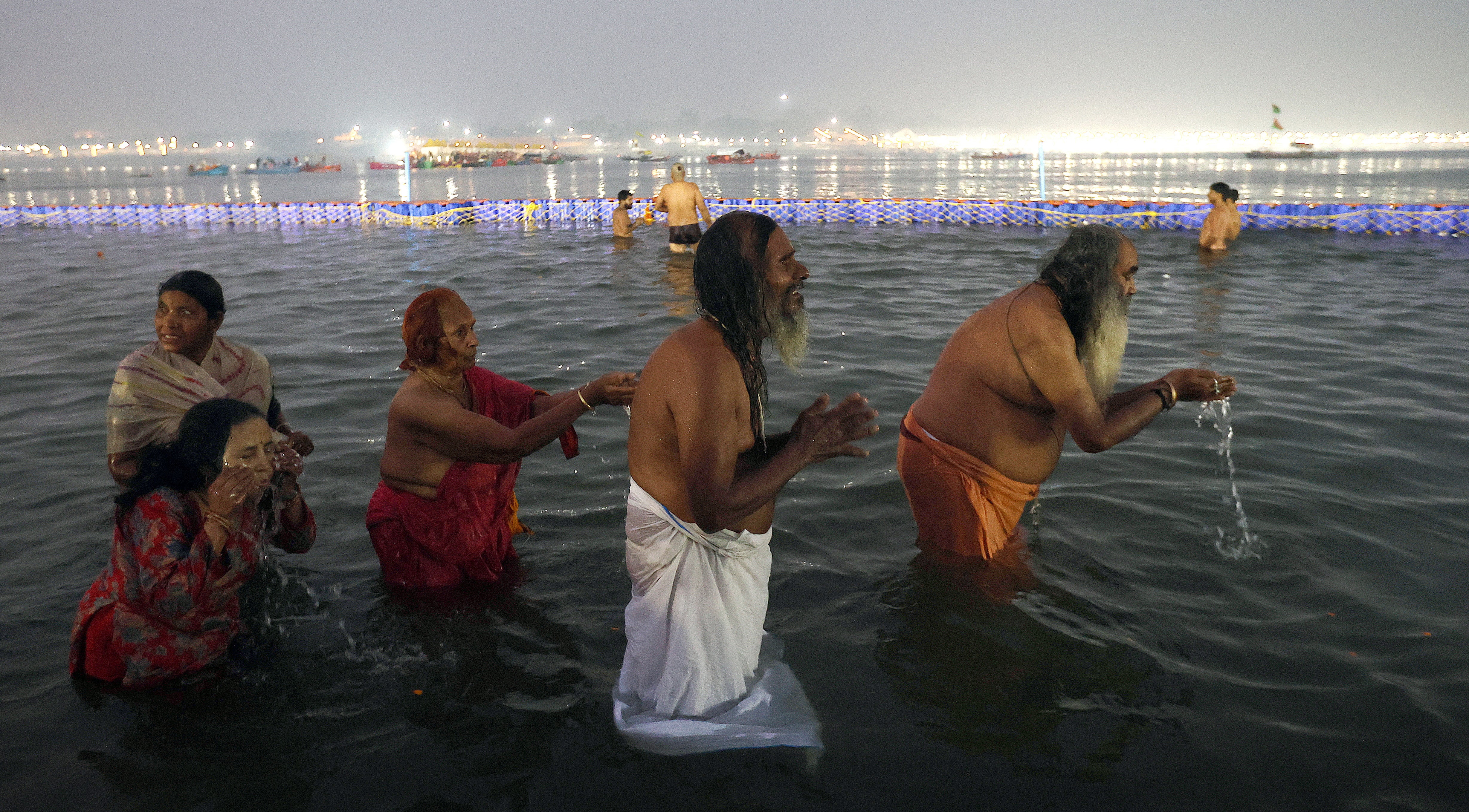 Hindu devotees take a ‘holy bath’ at Sangam, the confluence of three of the holiest rivers in Hindu mythology – Ganga, Yamuna, and the mythical Saraswati