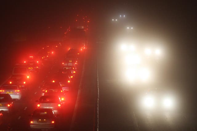 Traffic in the fog (Andrew Milligan/PA)