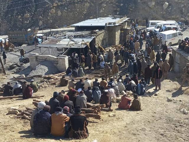 <p>Local residents gather as rescuers conduct an operation to recover coal mine workers following a methane gas explosion that caused a coal mine to collapse in Singidi, a remote area of southwest Pakistan’s Balochistan province, Friday, 10 January 2025</p>