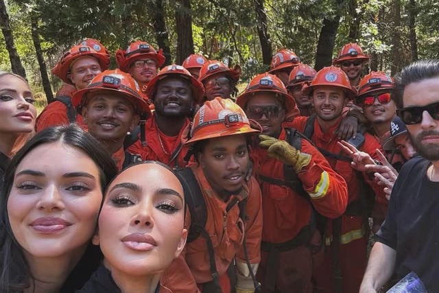 <p>Kim Kardashian, Kendall Jenner, and Scott Disick pictured with incarcerated LA firefighters in August 2024</p>