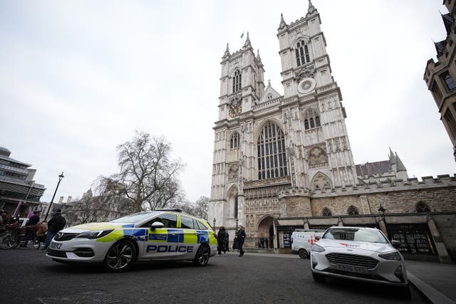 <p>Police attended Westminster Abbey, the site of Darwin’s grave, on Monday </p>