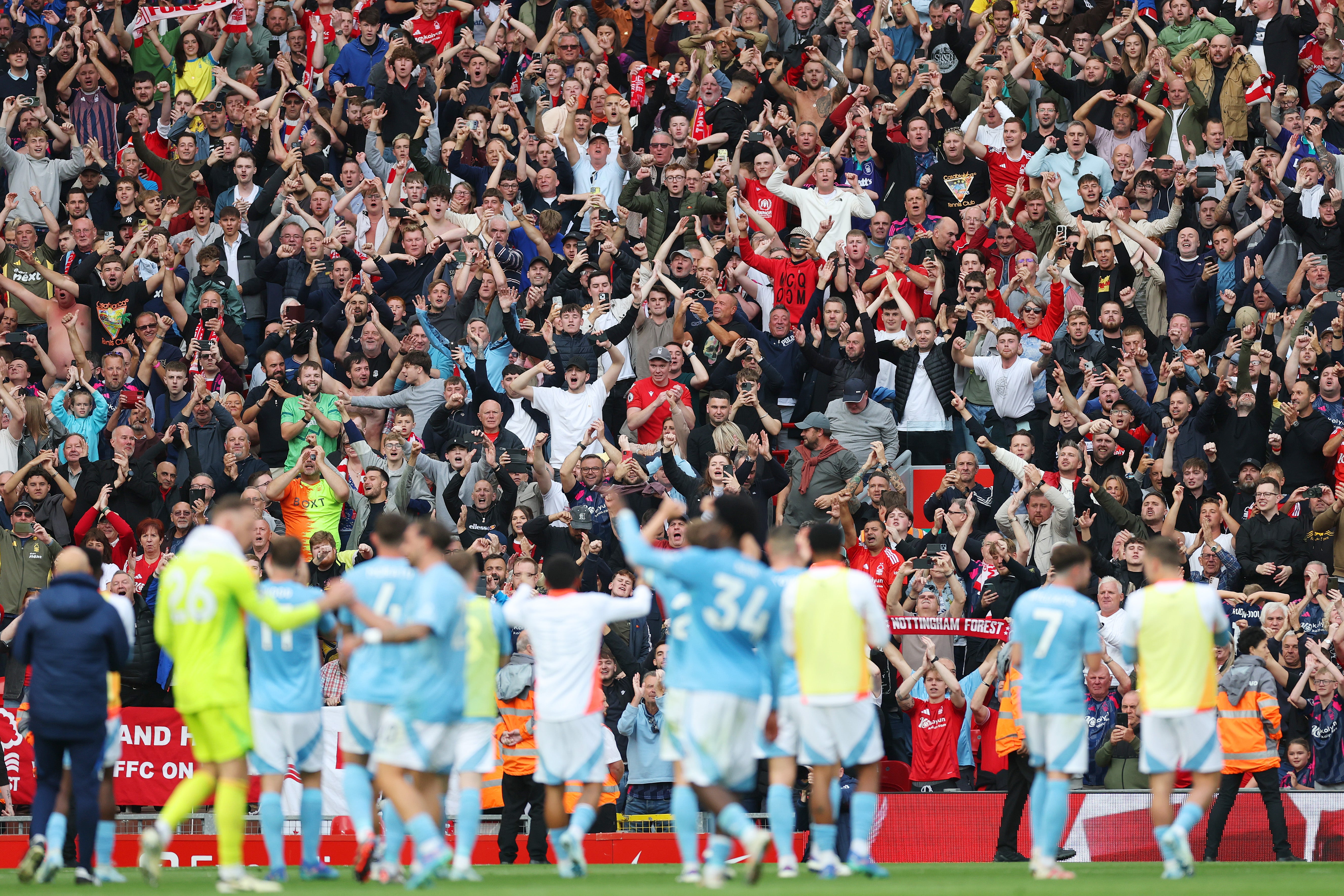 Fans of Nottingham Forest celebrate at Anfield