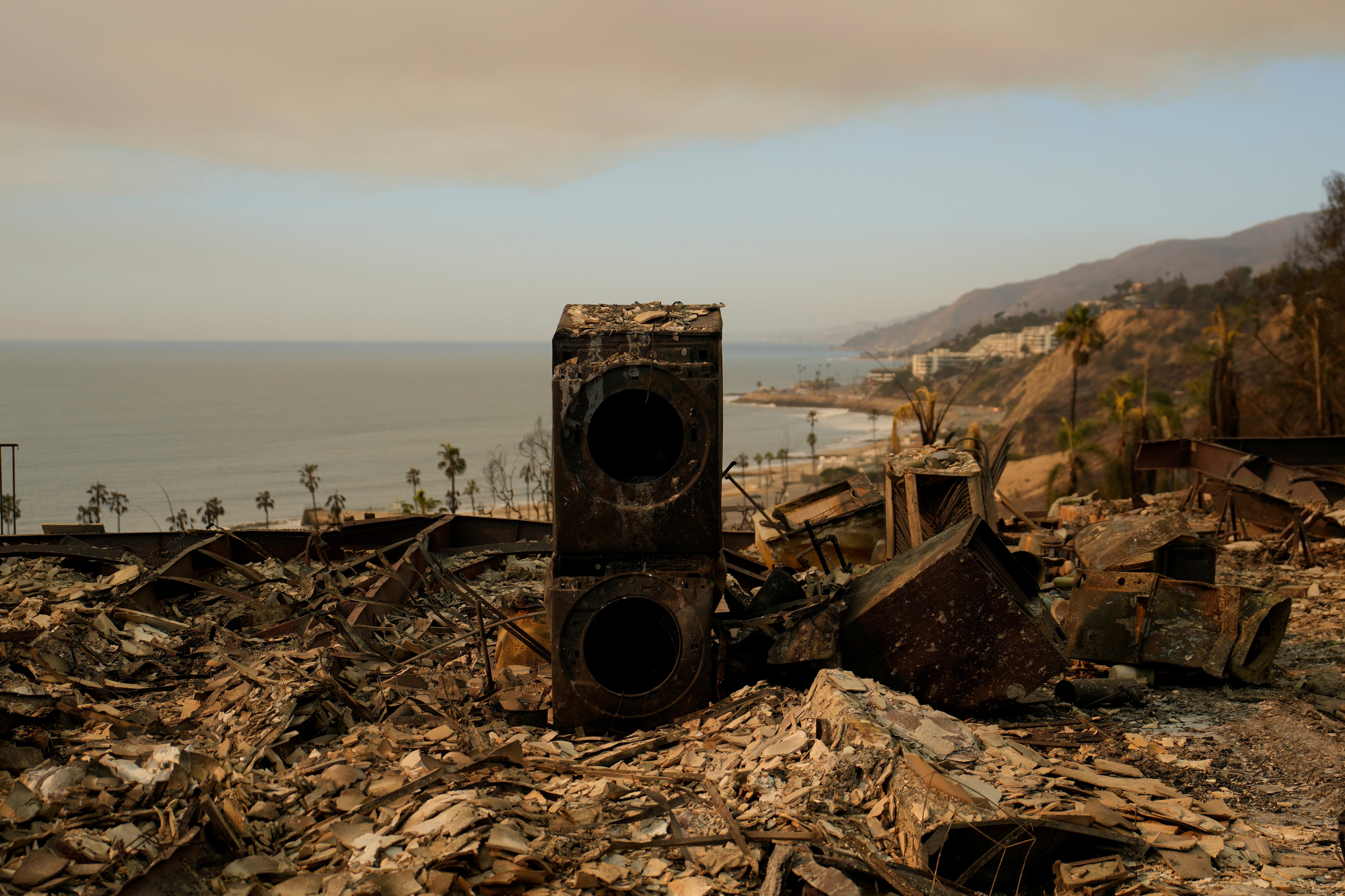 A washer and dryer is still standing in a property burned by the Palisades Fire in the Pacific Palisades neighborhood of Los Angeles, California, on Saturday. Thousands of people remain displaced in the area