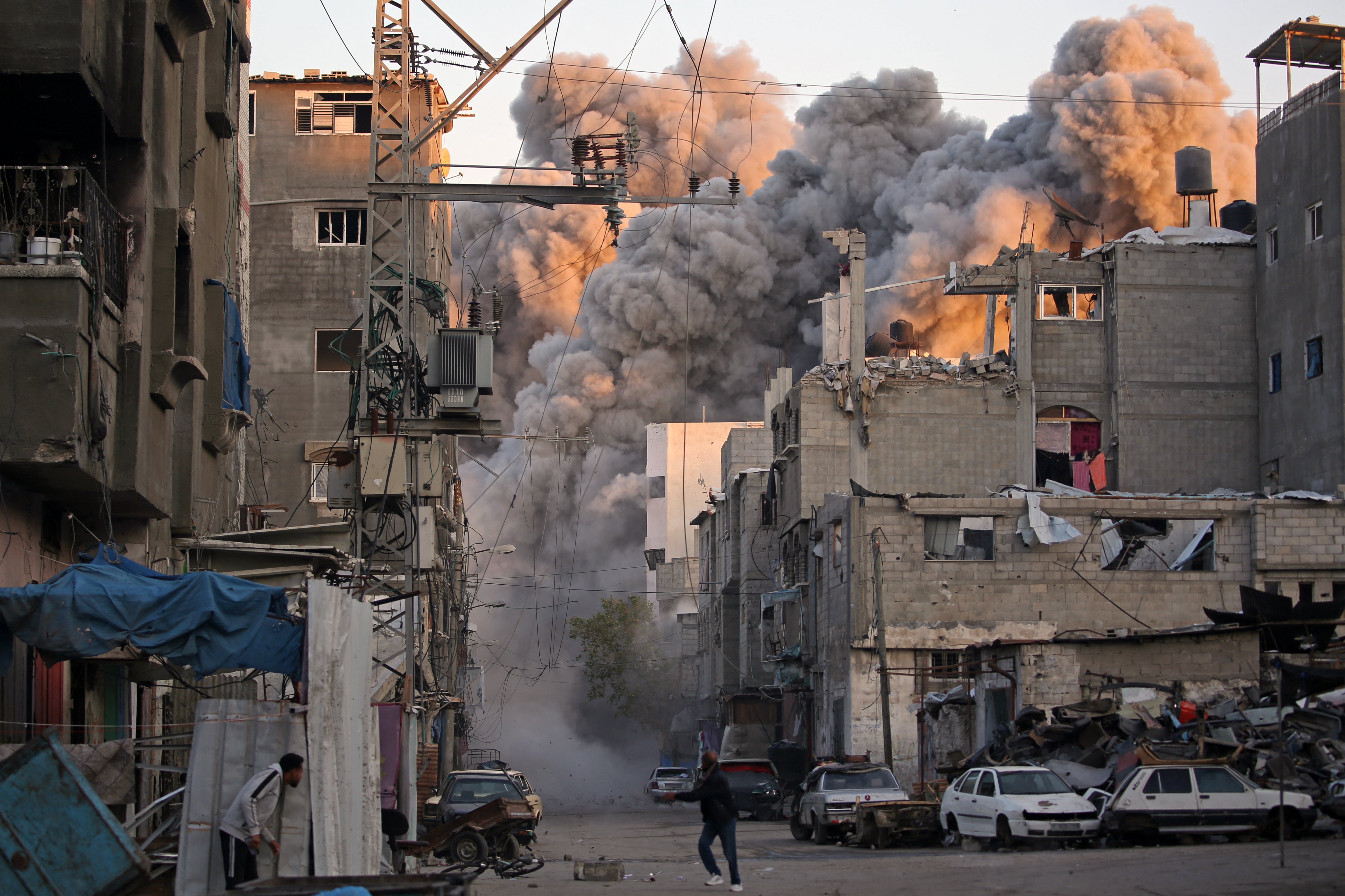 Smoke rises from a building destroyed in Israeli airstrike at the Bureij camp for Palestinian refugees in the central Gaza Strip