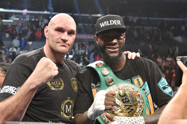 <p>Deontay Wilder (right) and Tyson Fury after their first fight</p>