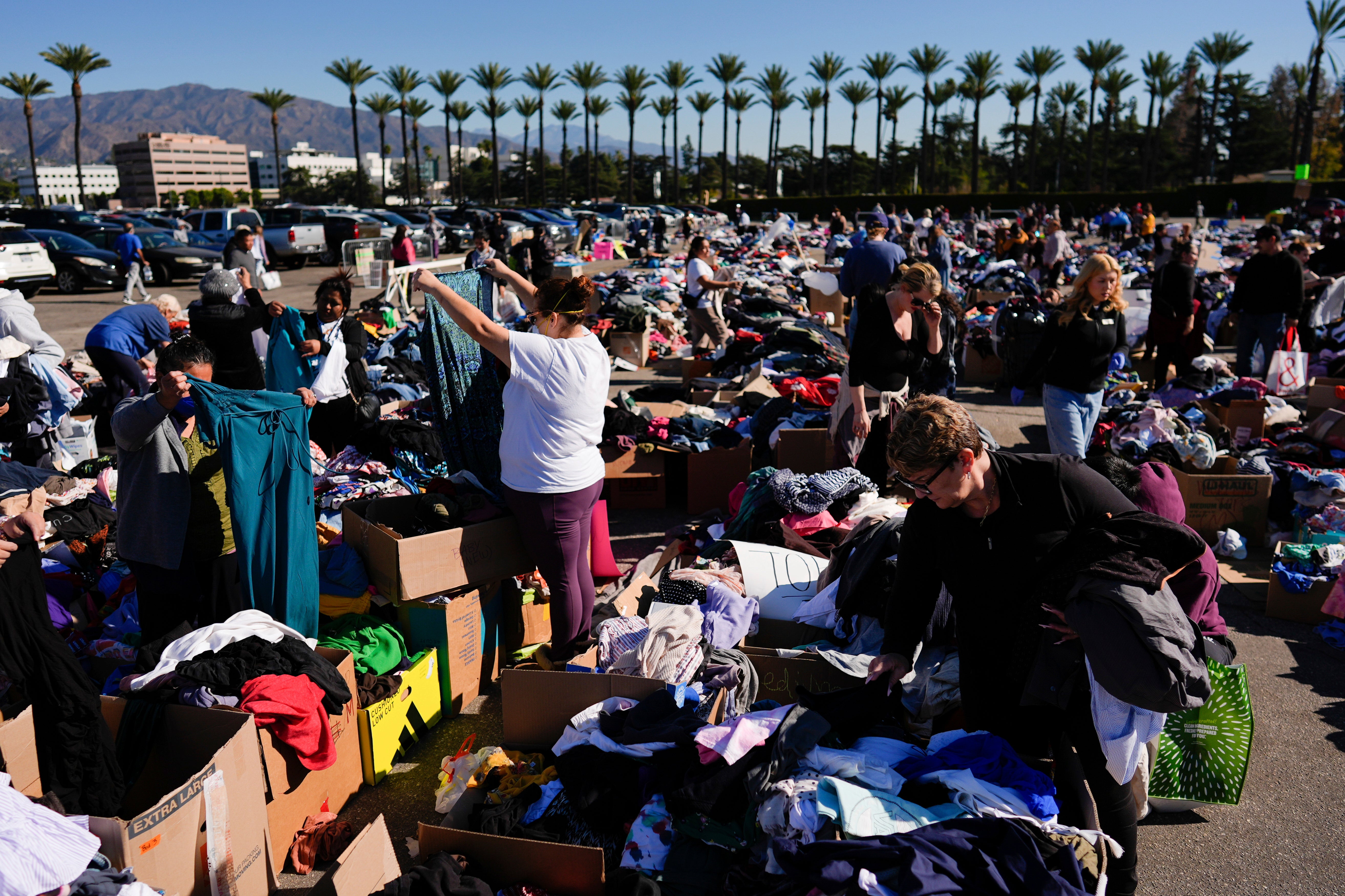 Items are laid out at an aid center for people affected by wildfires on Monday at Santa Anita Park in Arcadia, California. Multiple centers were open for people to donate and collect aid