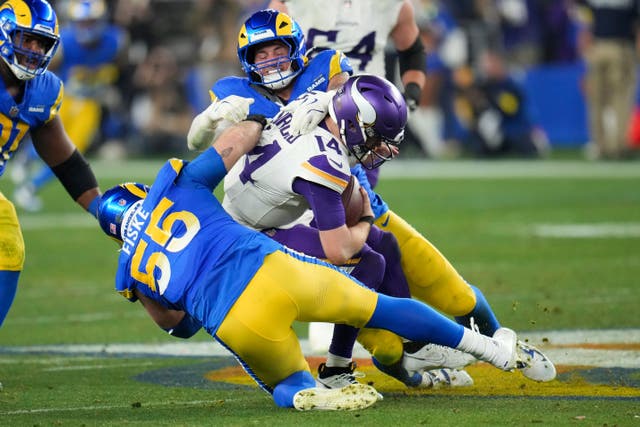 Los Angeles Rams defensive tackle Braden Fiske (55) and Michael Hoecht (97) sack Minnesota Vikings quarterback Sam Darnold (Ross D Franklin/AP)